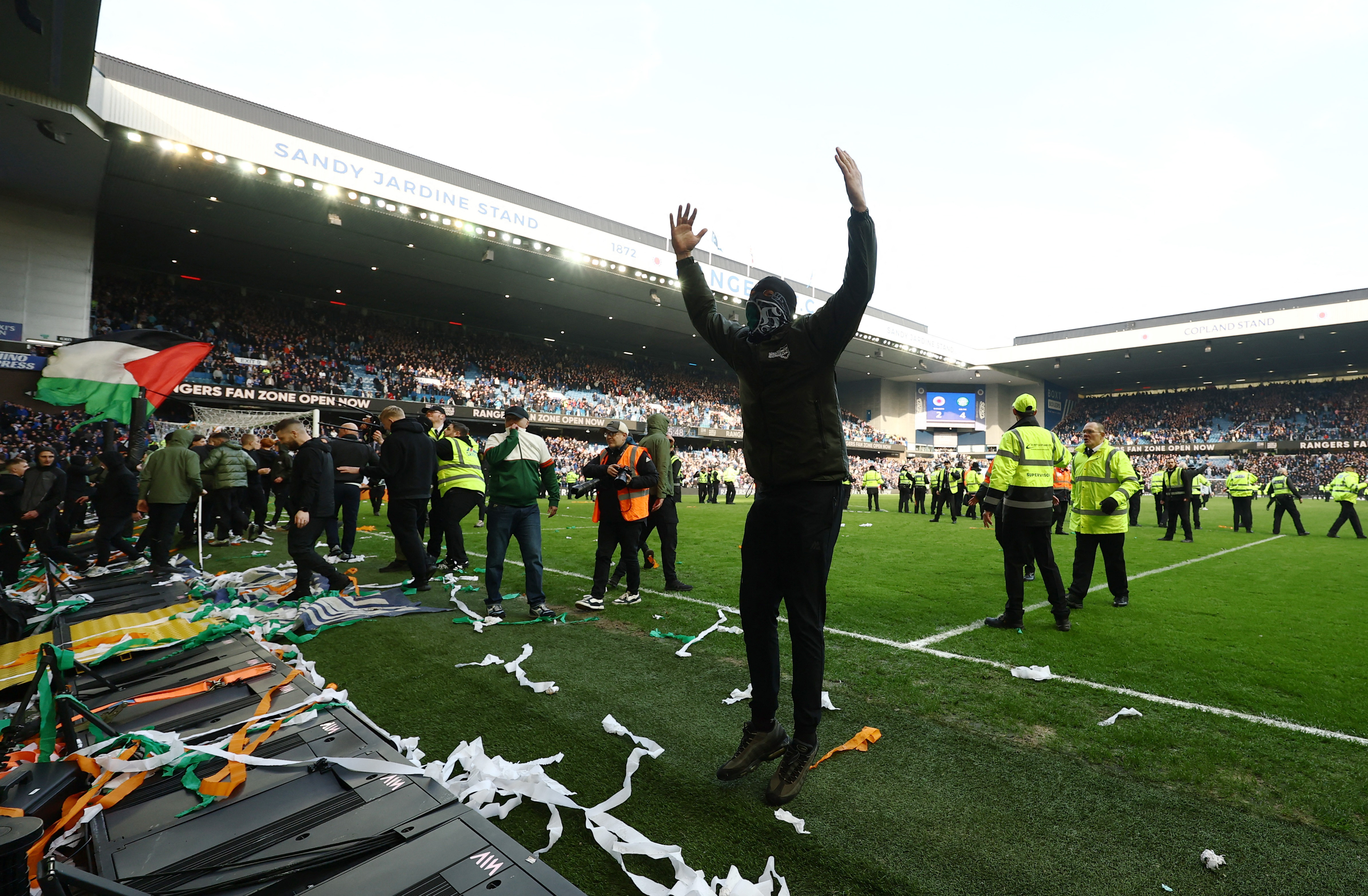 Soccer Football - Scottish League Cup - Quarter Final - Rangers v Celtic - Ibrox, Glasgow, Scotland, Britain - March 8, 2026 Rangers fans on the pitch after the match Action Images via REUTERS/Lee Smith