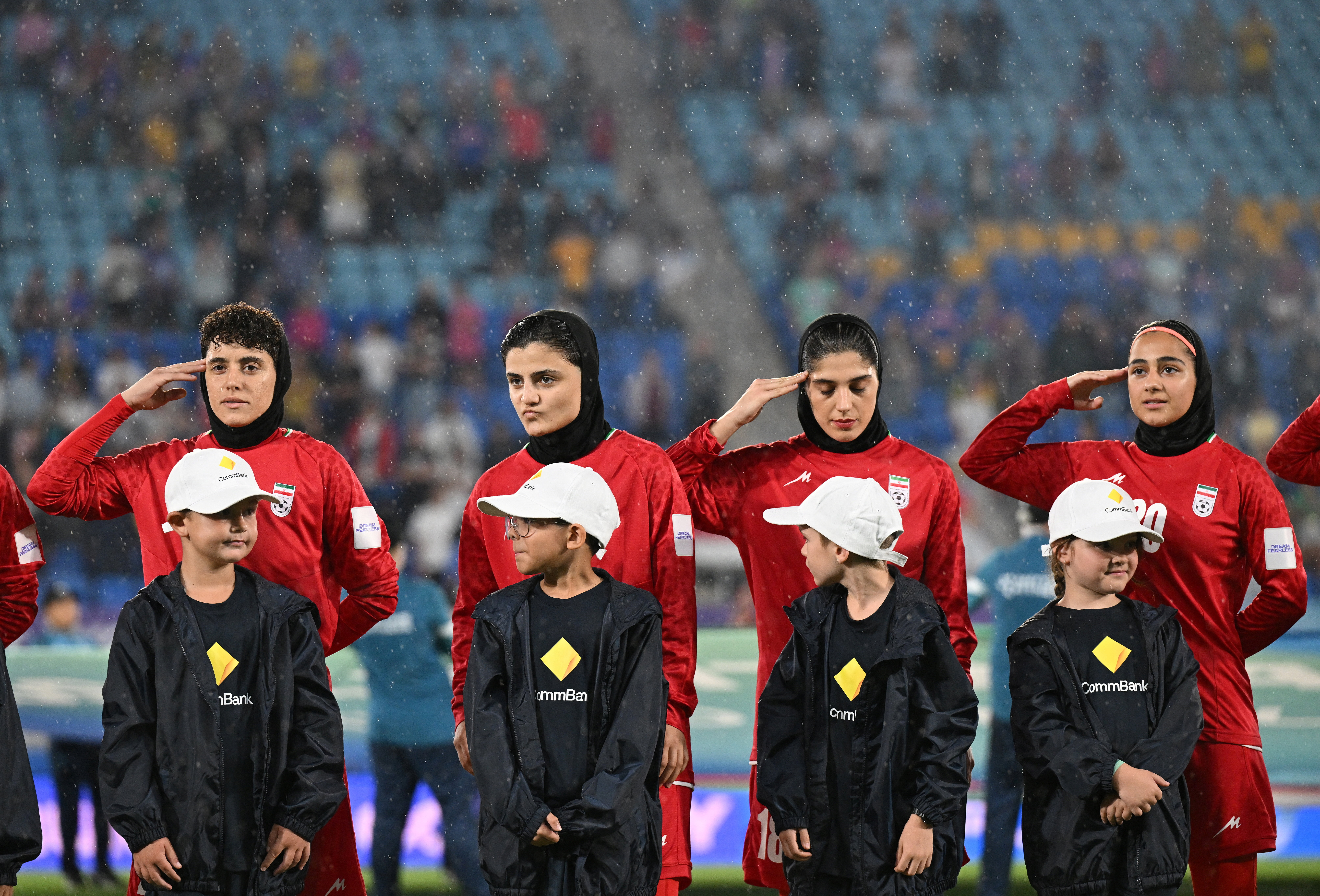 Soccer Football - AFC Women’s Asian Cup - Group A - Iran v Philippines - Gold Coast Stadium, Gold Coast, Australia - March 8, 2026 Iran players during their national anthem before the match Dave Hunt/AAP Image via REUTERS  ATTENTION EDITORS - THIS IMAGE W