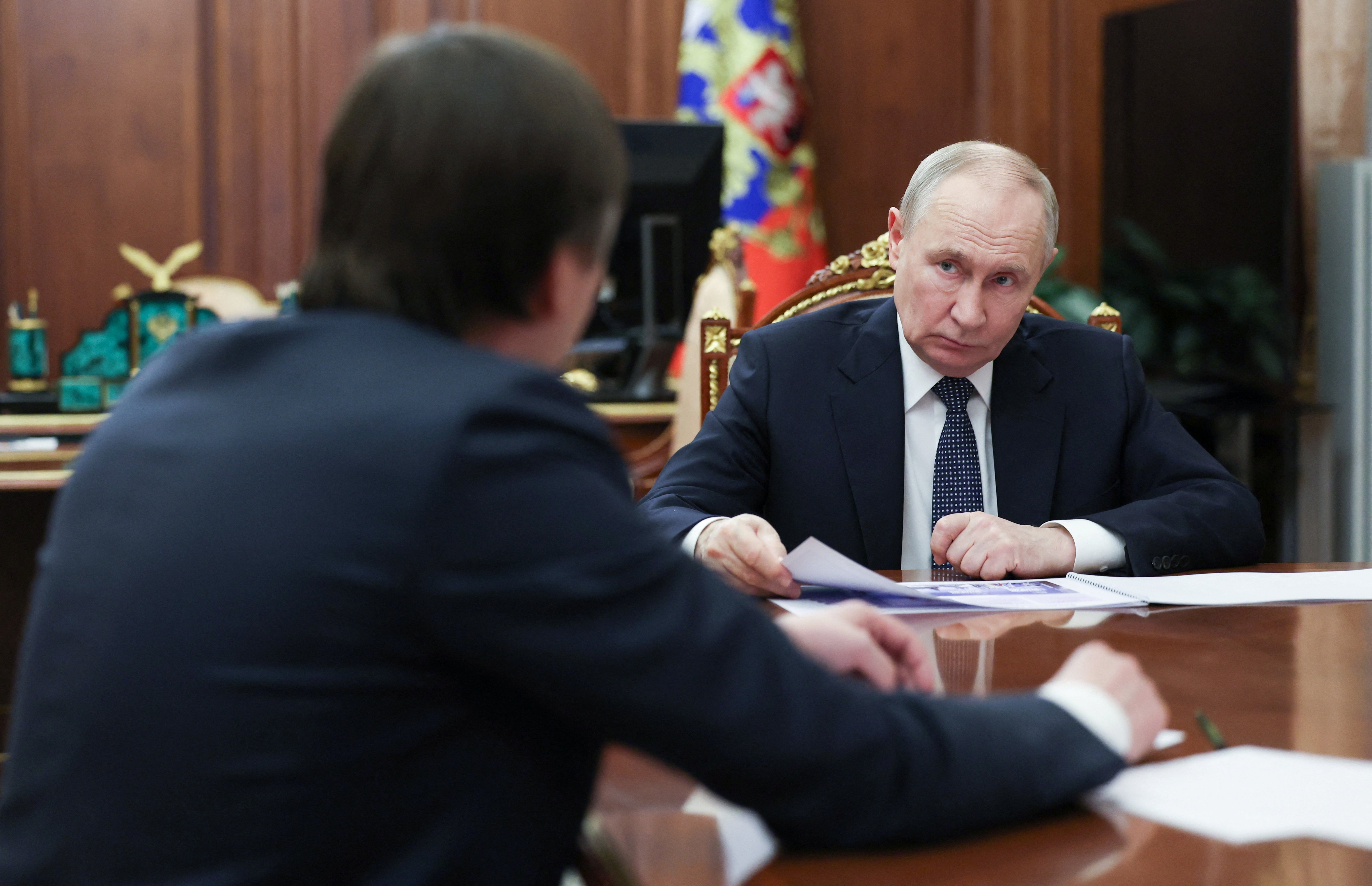 Russian President Vladimir Putin attends a meeting with Minister of Education
