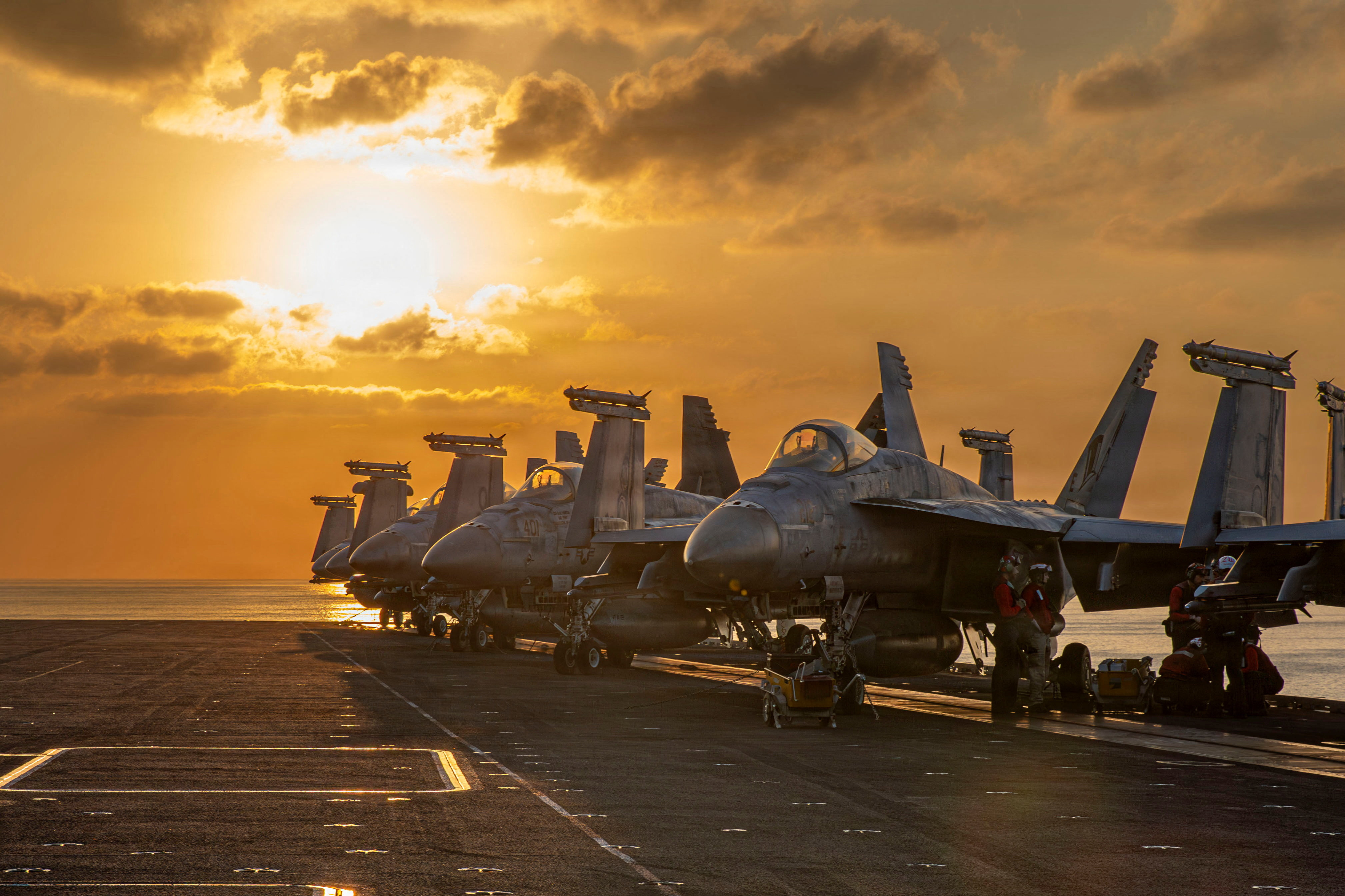 Aircraft are staged for flight operations on the flight deck of the