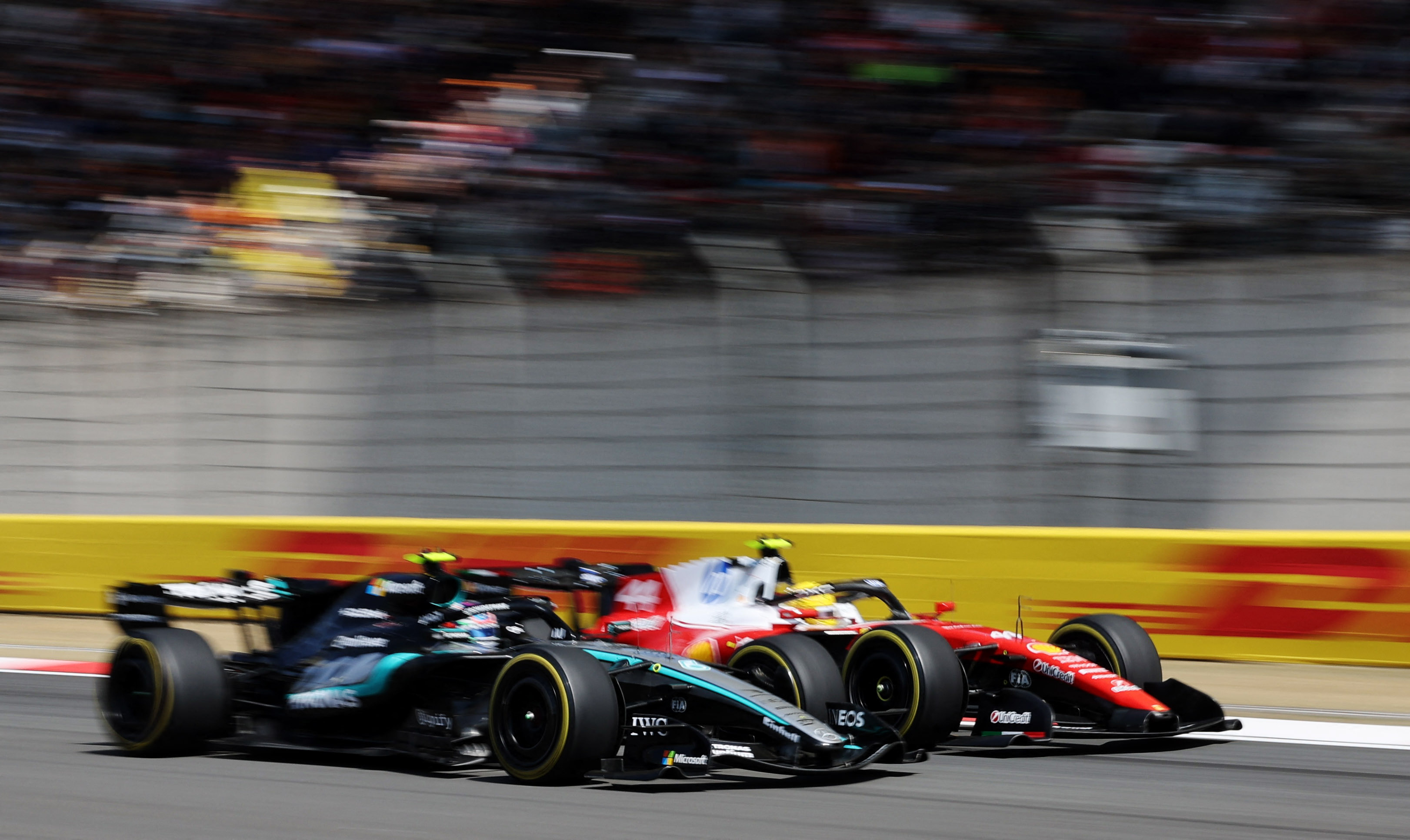 Formula One F1 - Chinese Grand Prix - Shanghai International Circuit, Shanghai, China - March 14, 2026 Mercedes' George Russell and Ferrari's Lewis Hamilton in action during the sprint race REUTERS/Go Nakamura