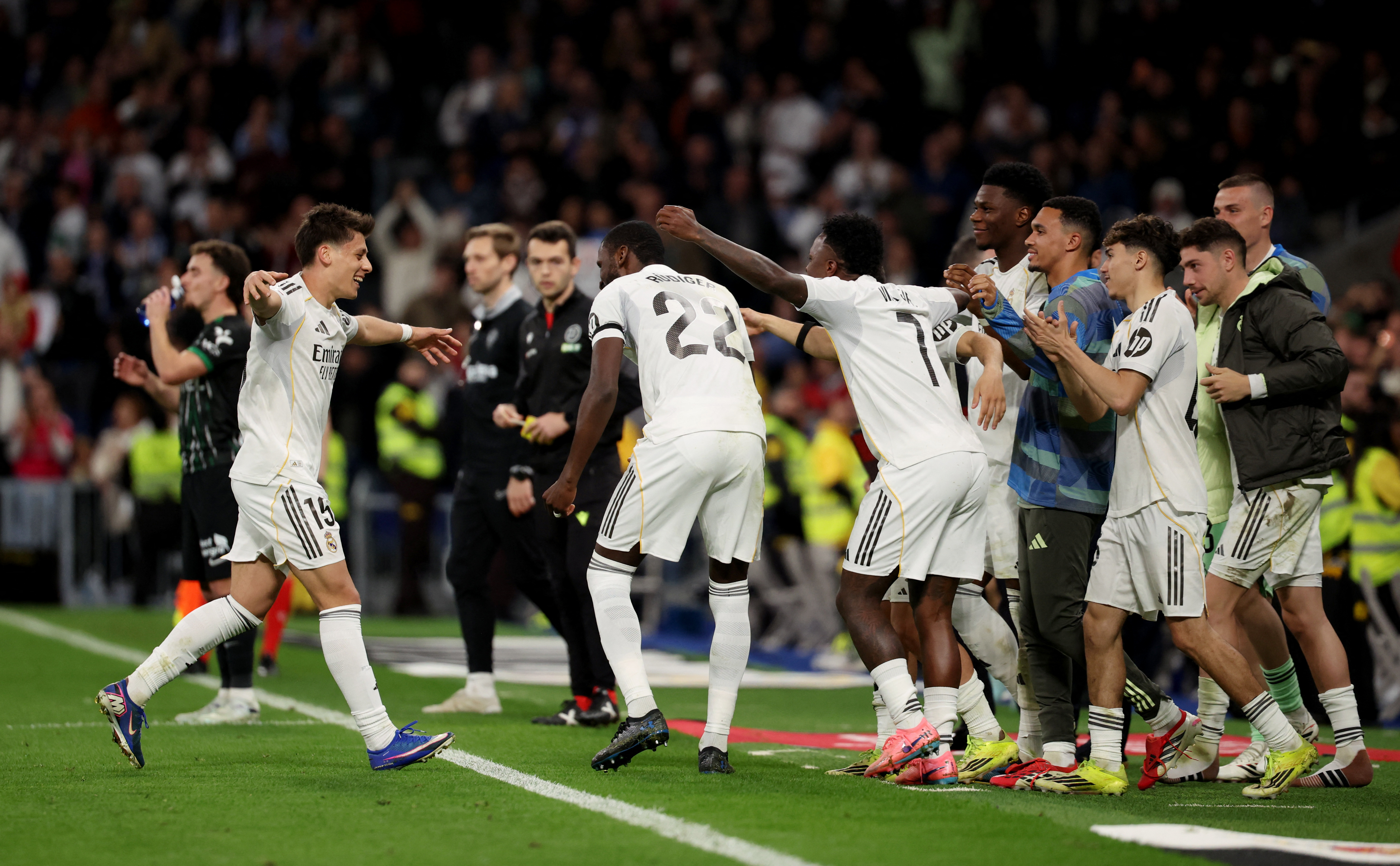 Soccer Football - LaLiga - Real Madrid v Elche - Santiago Bernabeu, Madrid, Spain - March 14, 2026 Real Madrid's Arda Guler celebrates scoring their fourth goal with Antonio Rudiger, Vinicius Junior and teammates REUTERS/Alejandro Martinez Velez
