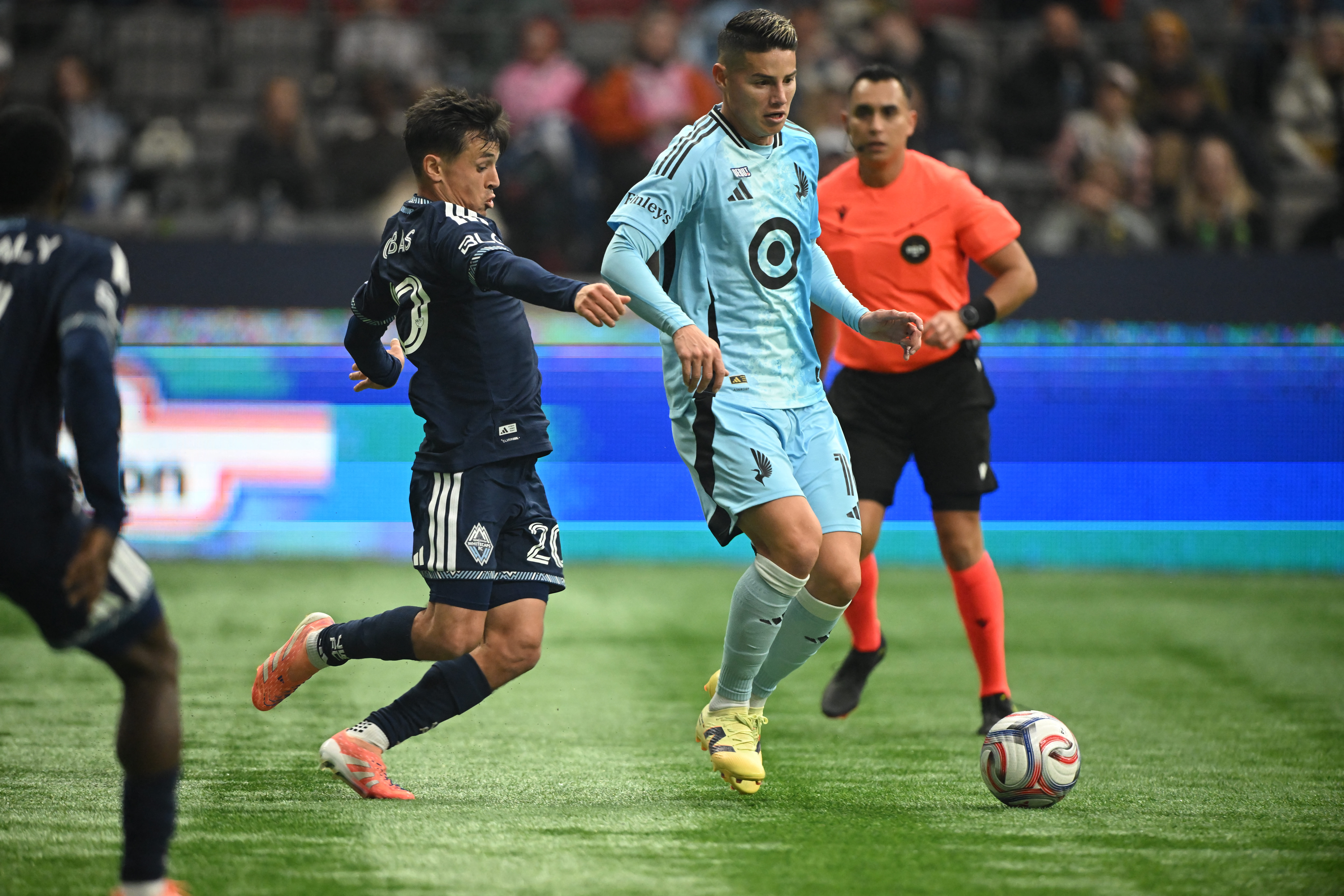 Mar 15, 2026; Vancouver, British Columbia, CAN;  Minnesota United fC midfielder James Rodriguez (10) controls the ball against Vancouver Whitecaps FC midfielder Andres Cubas (20) during the second half at BC Place. Mandatory Credit: Anne-Marie Sorvin-Imag