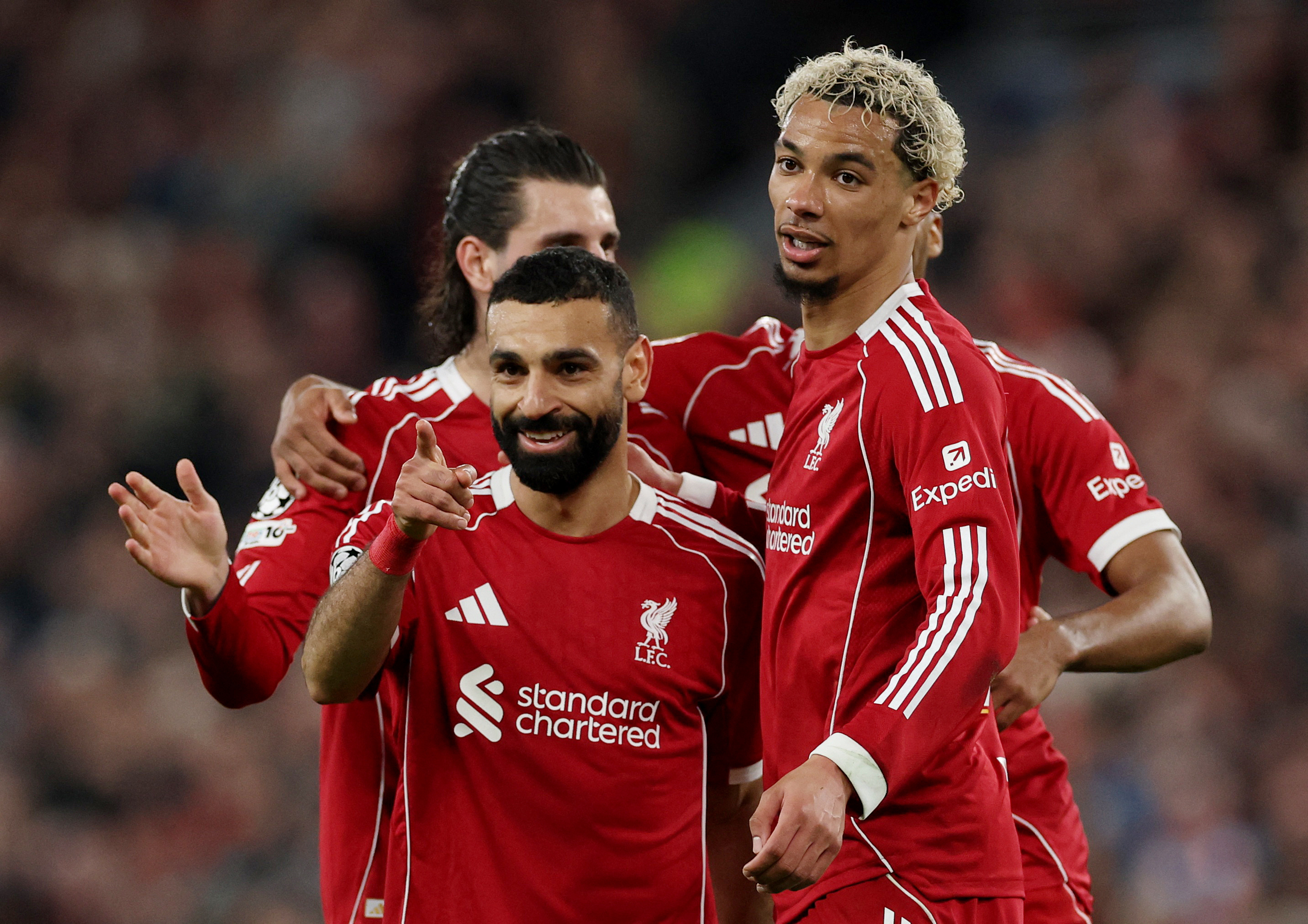 Soccer Football - UEFA Champions League - Round 16 - Second Leg - Liverpool v Galatasaray - Anfield, Liverpool, Britain - March 18, 2026 Liverpool's Mohamed Salah celebrates scoring their fourth goal with Hugo Ekitike REUTERS/Phil Noble