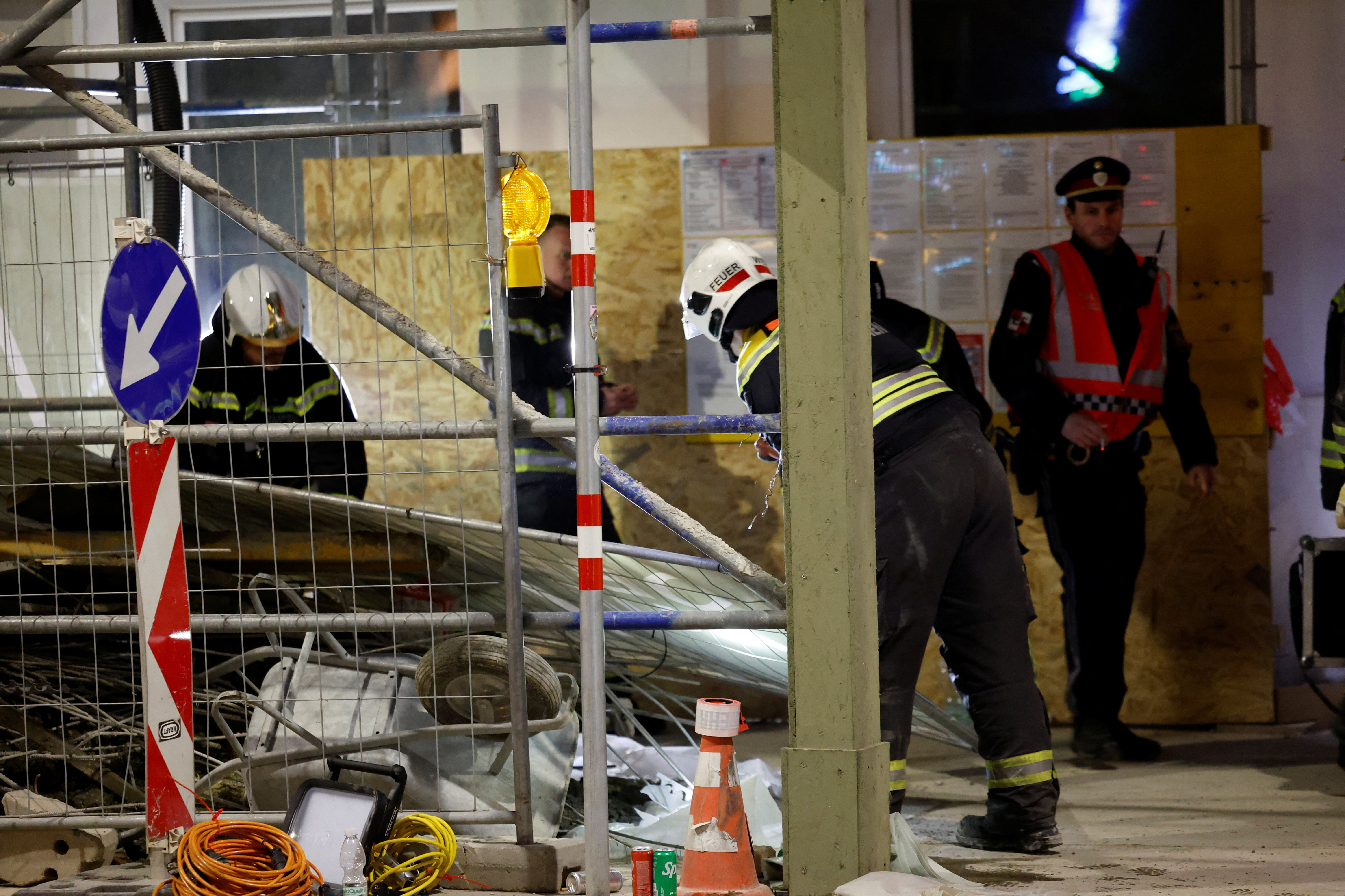 Firefighters work at a construction site after scaffolding collapsed in the upmarket ninth district of Vienna, Austria, March 17, 2026. REUTERS/Lisa Leutner