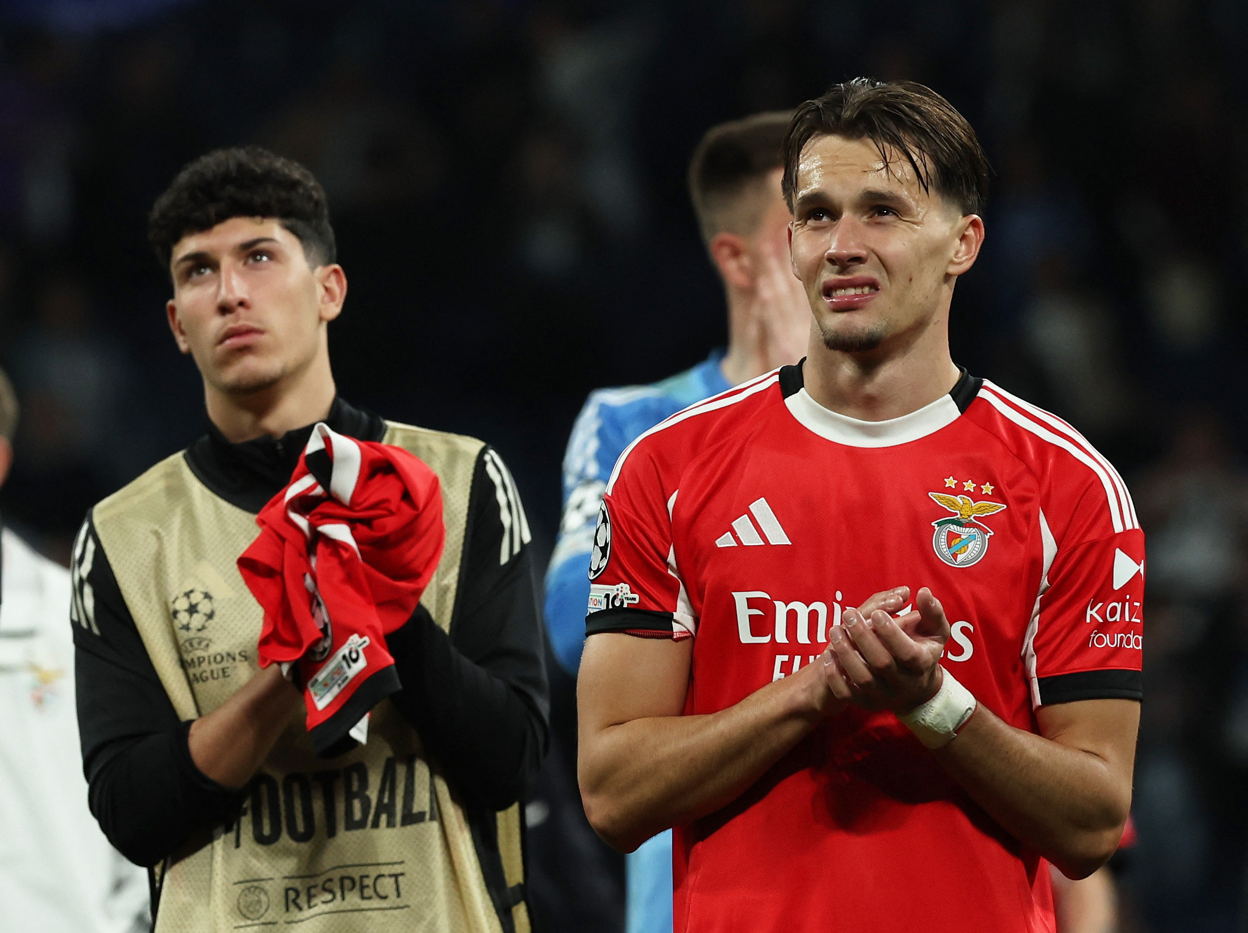 Soccer Football - UEFA Champions League - Play Off - Second Leg - Real Madrid v Benfica - Santiago Bernabeu, Madrid, Spain - February 25, 2026 Benfica's Amar Dedic and Jose Neto look dejected after the match REUTERS/Violeta Santos Moura