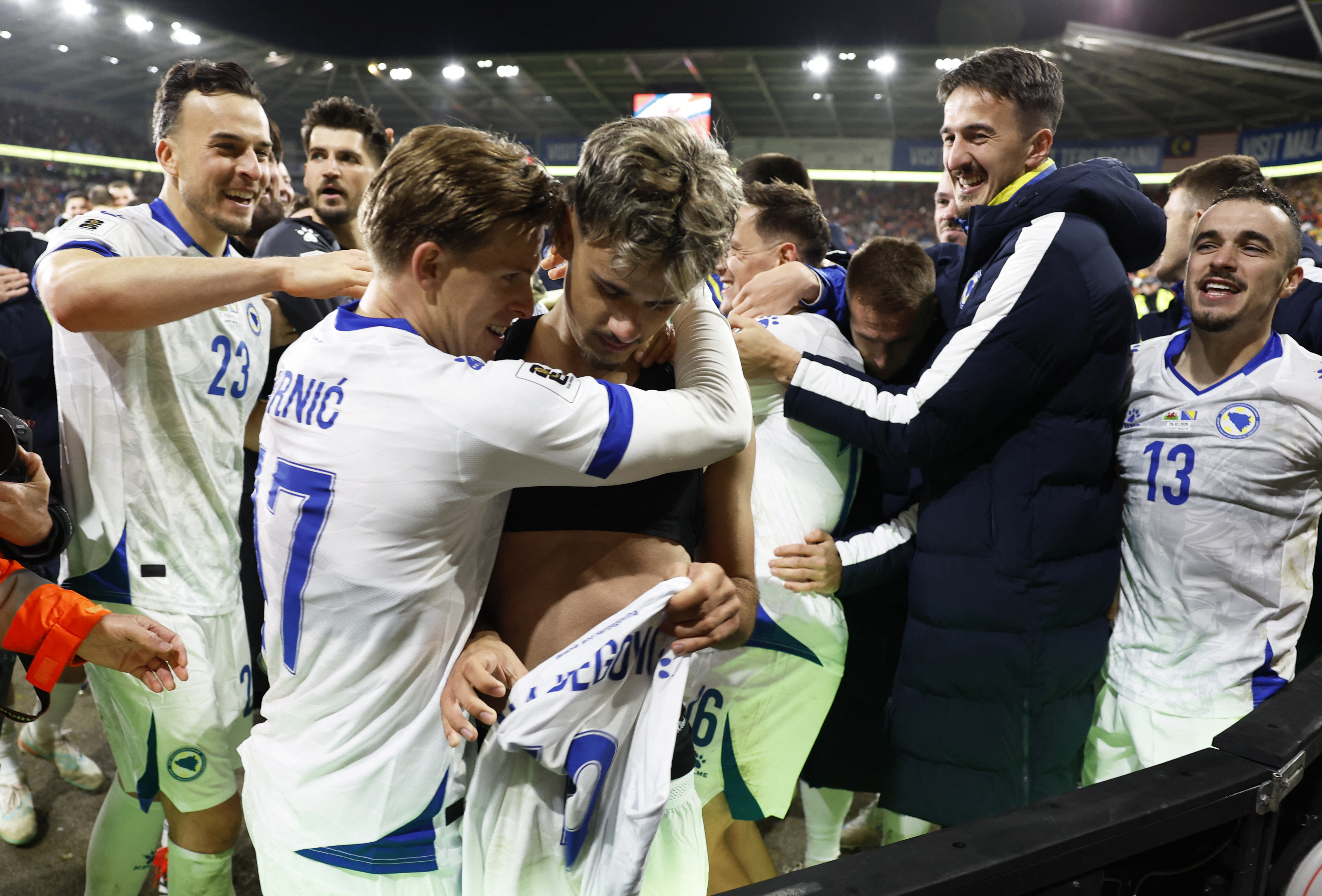 Soccer Football - FIFA World Cup - UEFA Qualifiers - Semi Final - Wales v Bosnia and Herzegovina - Cardiff City Stadium, Cardiff, Wales, Britain - March 26, 2026 Bosnia and Herzegovina's Kerim Alajbegovic celebrates with teammates after scoring a penalty