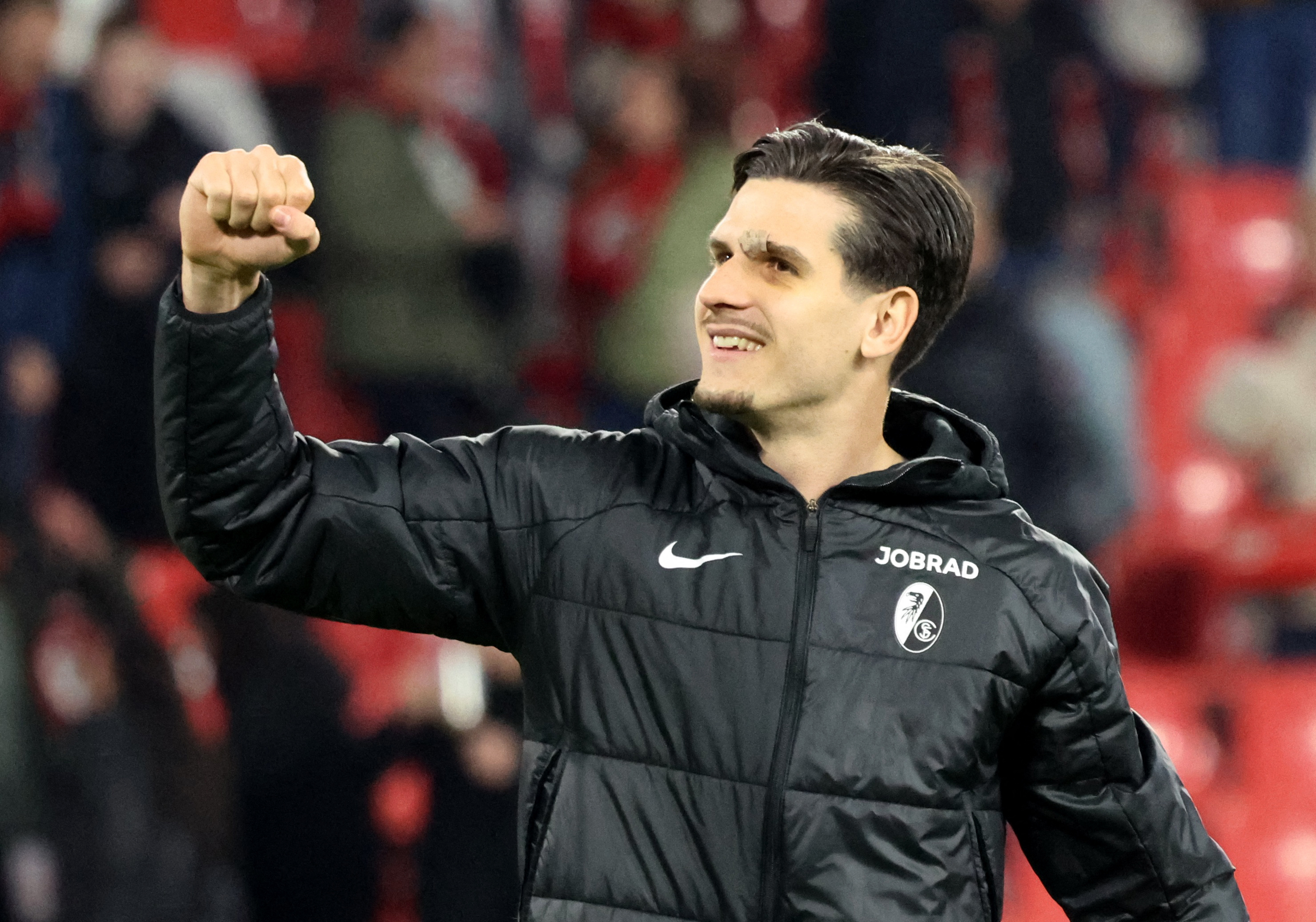 Soccer Football - UEFA Europa League - Round of 16 - Second Leg - SC Freiburg v KRC Genk - Europa Park Stadion, Freiburg, Germany - March 19, 2026 SC Freiburg's Igor Matanovic celebrates after the match REUTERS/Robin Rudel