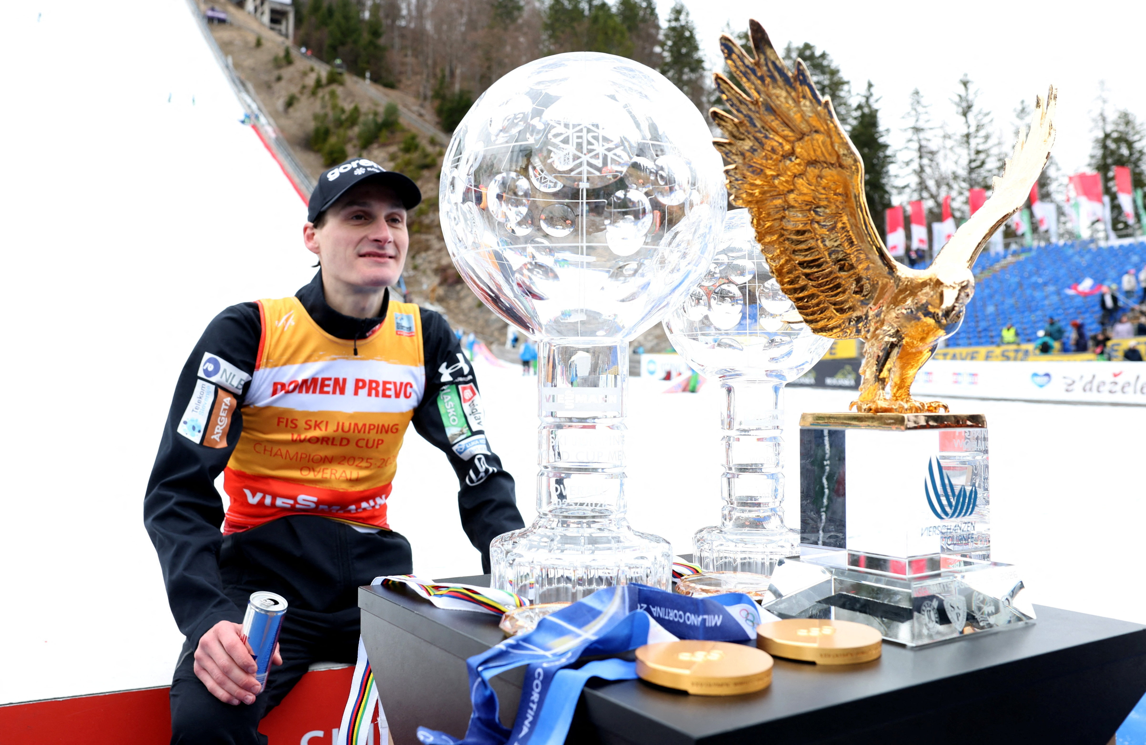 Ski Jumping - FIS Ski Jumping World Cup - Planica, Slovenia - March 29, 2026 Slovenia's Domen Prevc celebrates with his trophies after winning the ski jumping overall and ski flying overall REUTERS/Borut Zivulovic     TPX IMAGES OF THE DAY