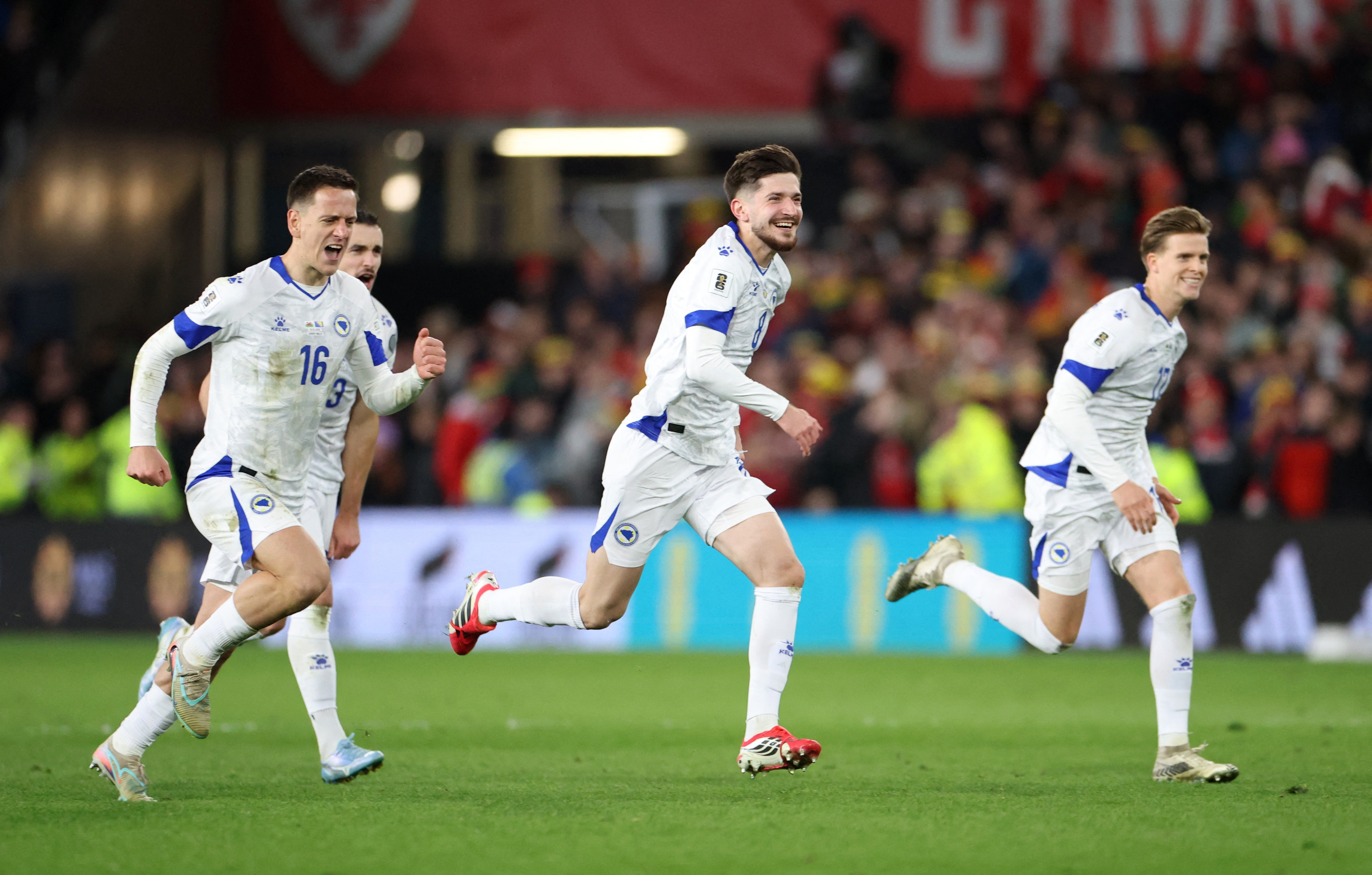 Soccer Football - FIFA World Cup - UEFA Qualifiers - Semi Final - Wales v Bosnia and Herzegovina - Cardiff City Stadium, Cardiff, Wales, Britain - March 26, 2026 Bosnia and Herzegovina's Armin Gigovic and Amir Hadziahmetovic celebrate after winning the pe