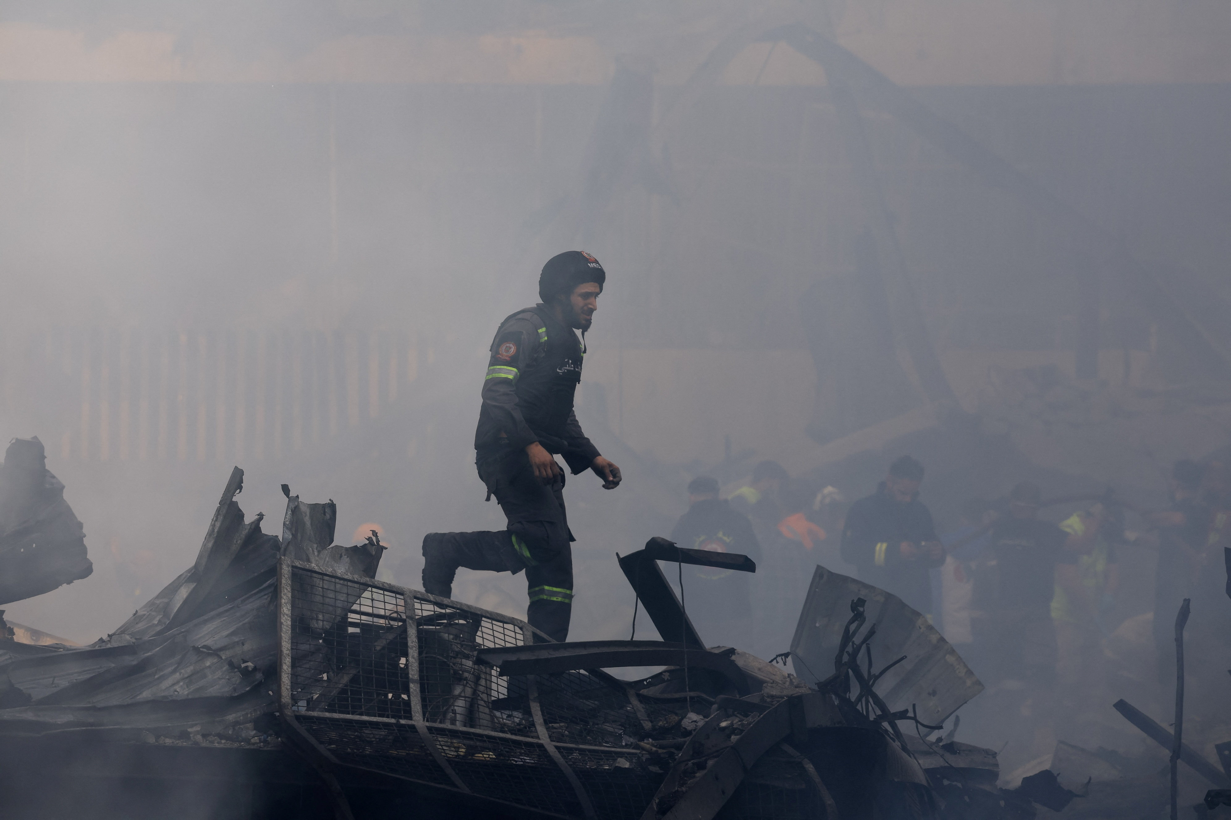 Rescuers work at the site of an Israeli strike in Beirut