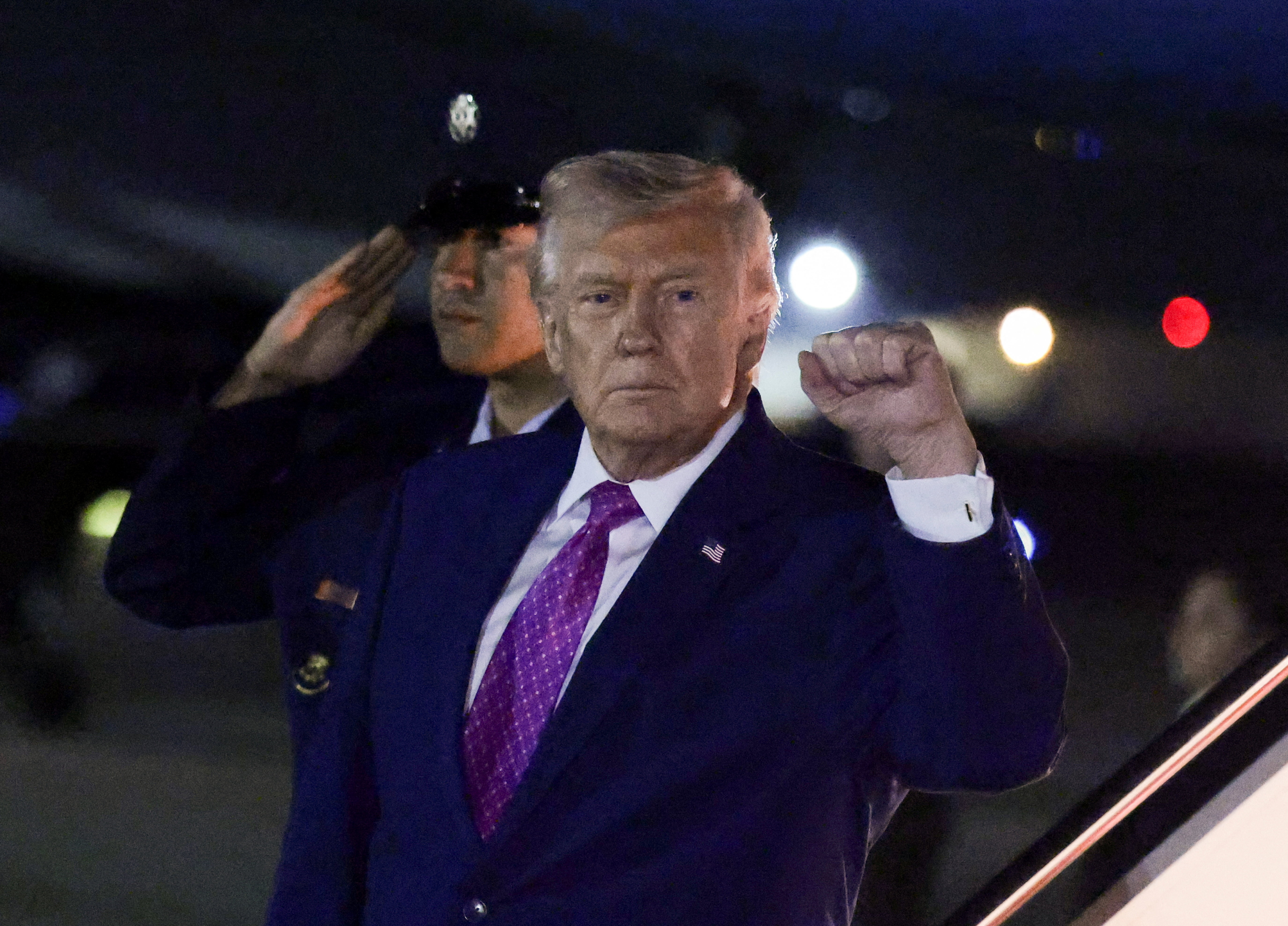 U.S. President Donald Trump gestures after deboarding from Air Force One as he returns from Virginia, at Joint Base Andrews in Maryland, U.S., April 10, 2026. REUTERS/Evelyn Hockstein