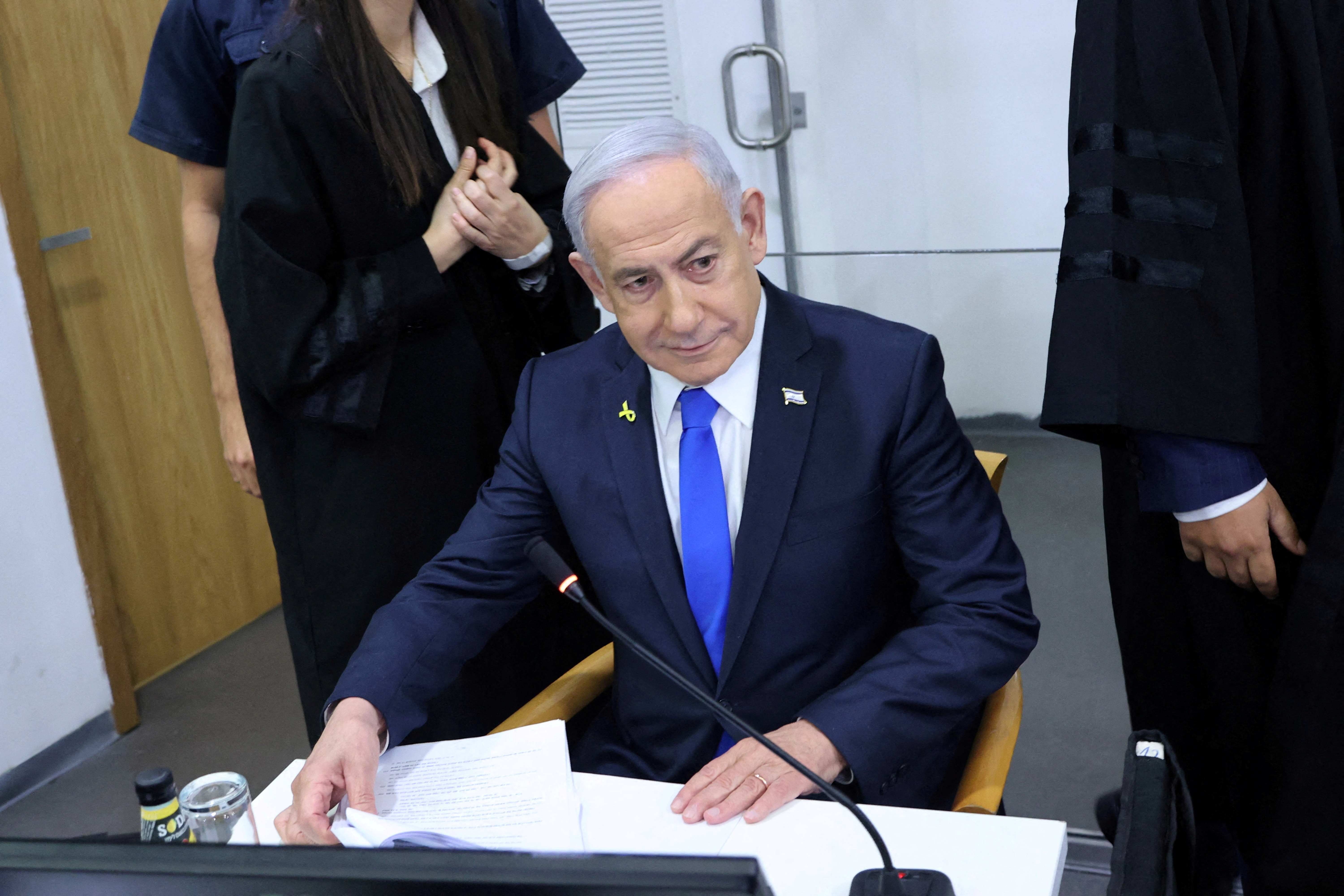 FILE PHOTO: Israeli Prime Minister Benjamin Netanyahu attends his trial on corruption charges at the district court in Tel Aviv, Israel, 21 April, 2025.    Moti Kimchi/Pool via REUTERS/File Photo