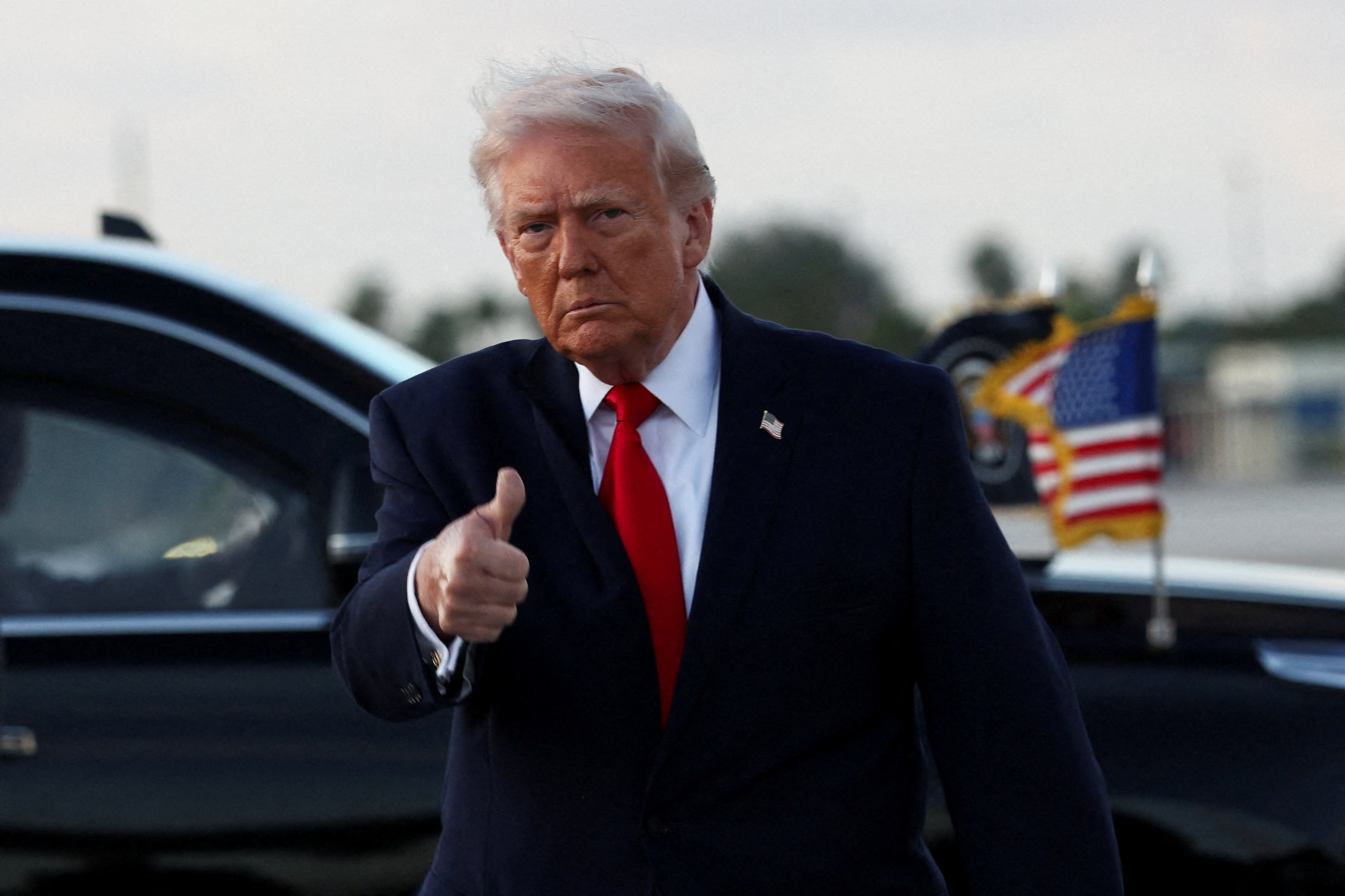 U.S. President Donald Trump gives a thumbs up as he arrives at Miami International Airport in Florida, U.S., April 11, 2026.  REUTERS/Kevin Lamarque