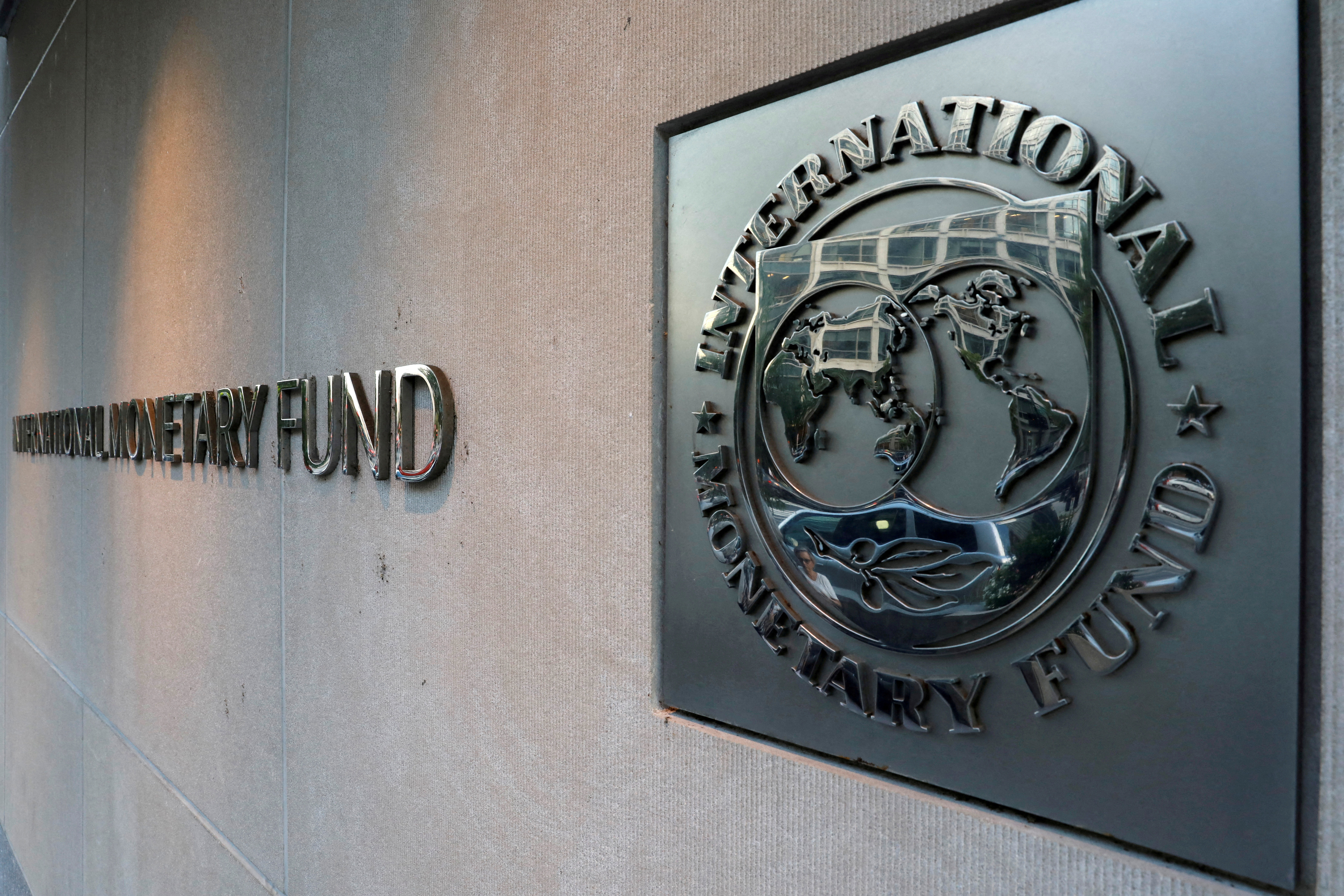 FILE PHOTO: International Monetary Fund (IMF) logo is seen outside the headquarters building in Washington, U.S., September 4, 2018. REUTERS/Yuri Gripas/File Photo