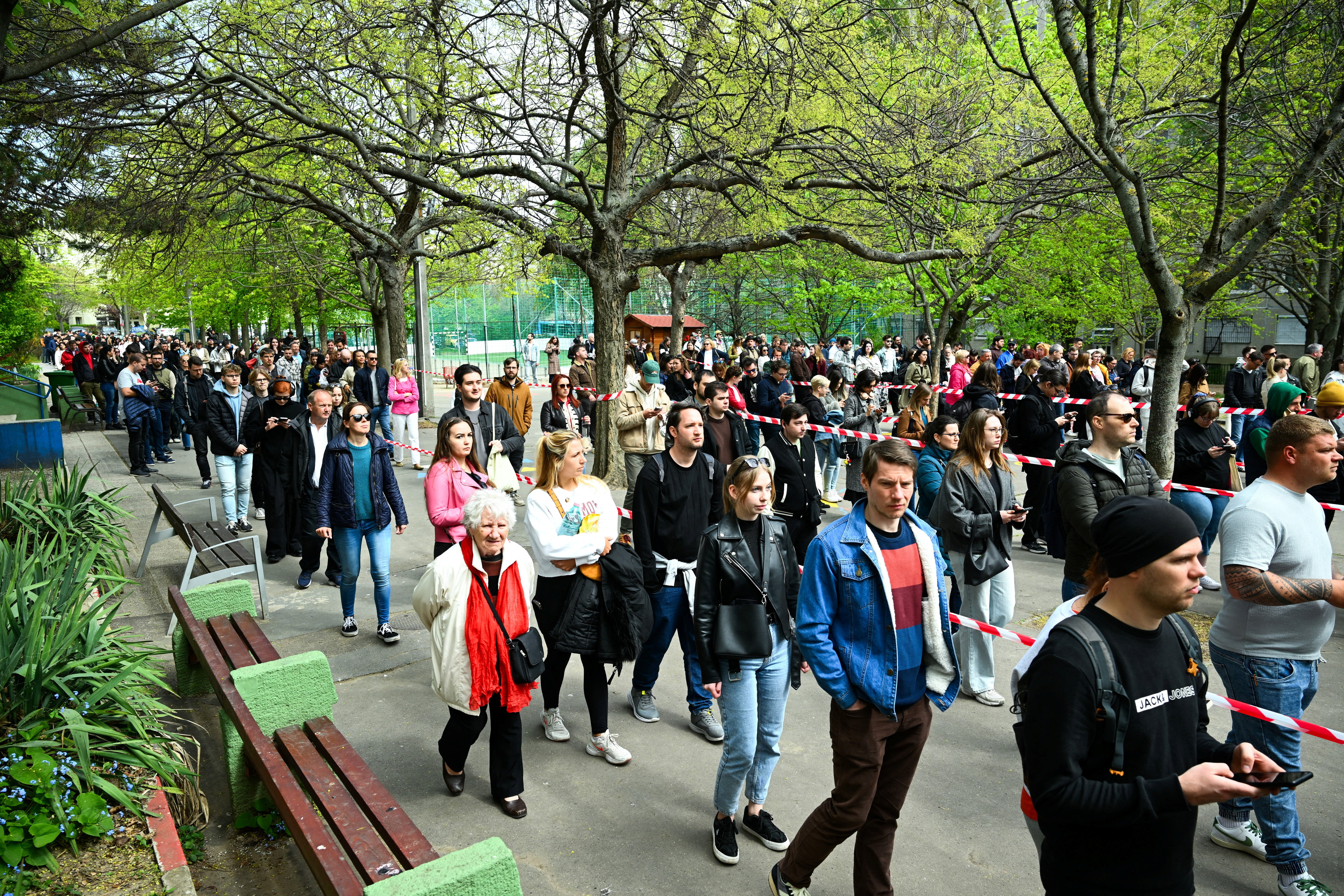 People wait in queue to vote outside a polling station during the Hungarian parliamentary election in Budapest, Hungary, April 12, 2026. REUTERS/Elisabeth Mandl