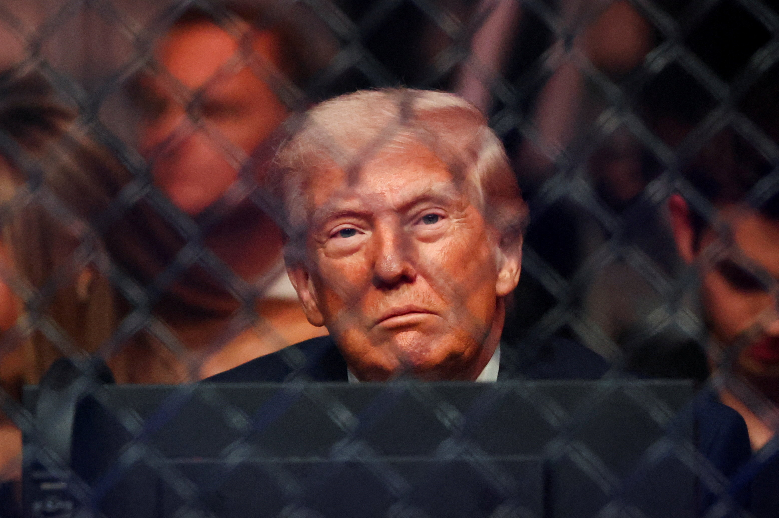 U.S. President Donald Trump watches a match during the UFC 327 event at Kaseya Center in Miami, Florida, U.S., April 11, 2026.  REUTERS/Kevin Lamarque