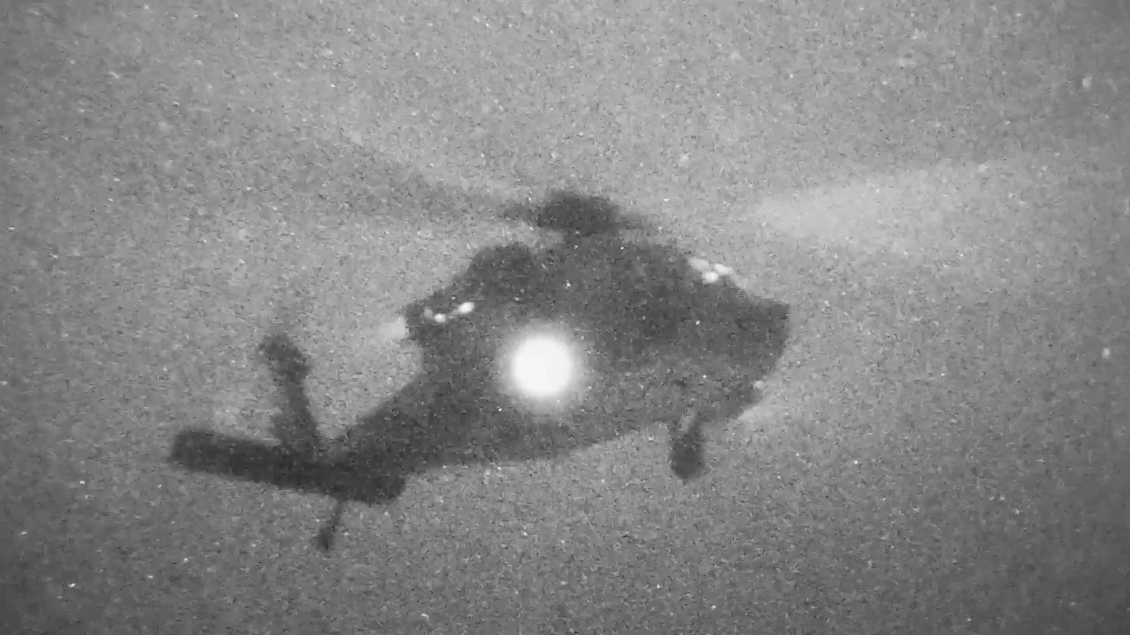 A helicopter carries U.S. Marines from the amphibious assault