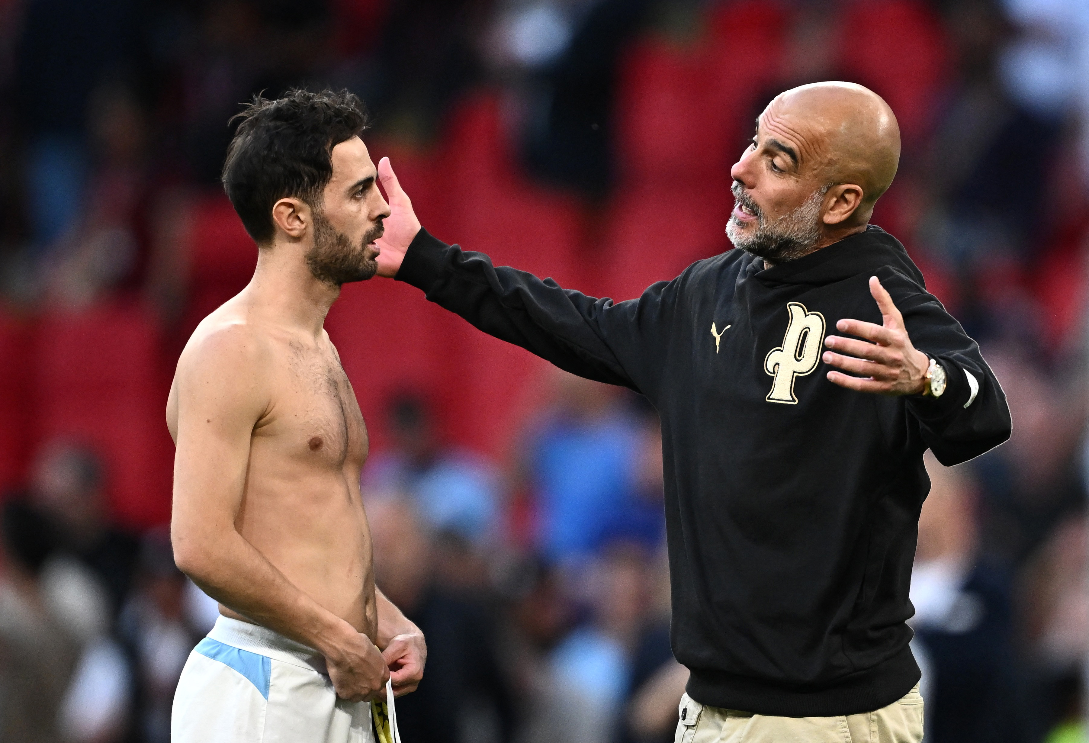 Soccer Football - FA Cup - Semi Final - Manchester City v Southampton - Wembley Stadium, London, Britain - April 25, 2026 Manchester City manager Pep Guardiola and Bernardo Silva celebrate after the match REUTERS/Dylan Martinez