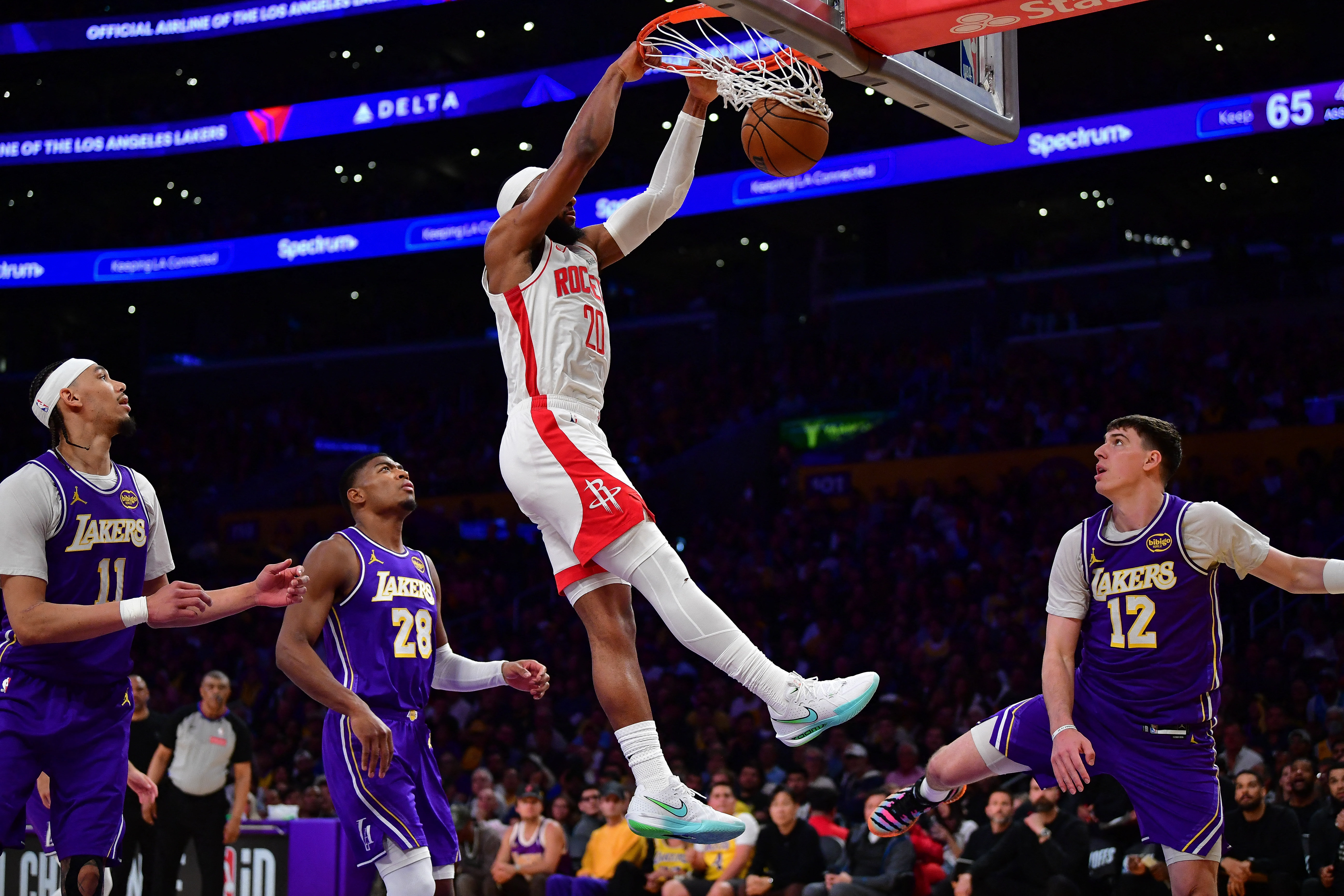 Apr 29, 2026; Los Angeles, California, USA; Houston Rockets guard Josh Okogie (20) dunks for the basket against the Los Angeles Lakers during the second half in game five of the first round of the 2026 NBA Playoffs at Crypto.com Arena. Mandatory Credit: G