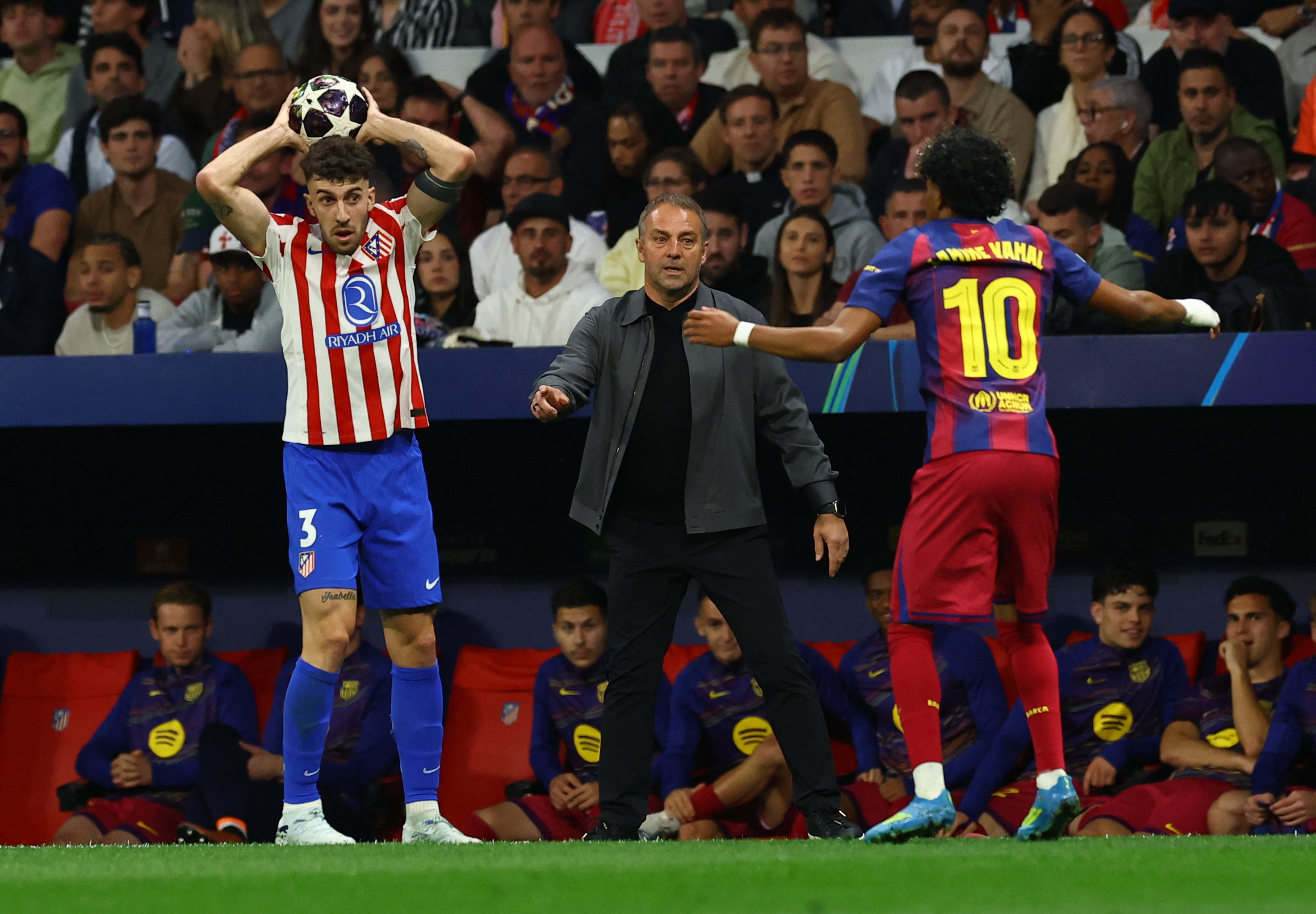 Soccer Football - UEFA Champions League - Quarter Final - Second Leg - Atletico Madrid v FC Barcelona - Riyadh Air Metropolitano, Madrid, Spain - April 14, 2026 Atletico Madrid's Matteo Ruggeri, FC Barcelona coach Hansi Flick and Lamine Yamal REUTERS/Albe
