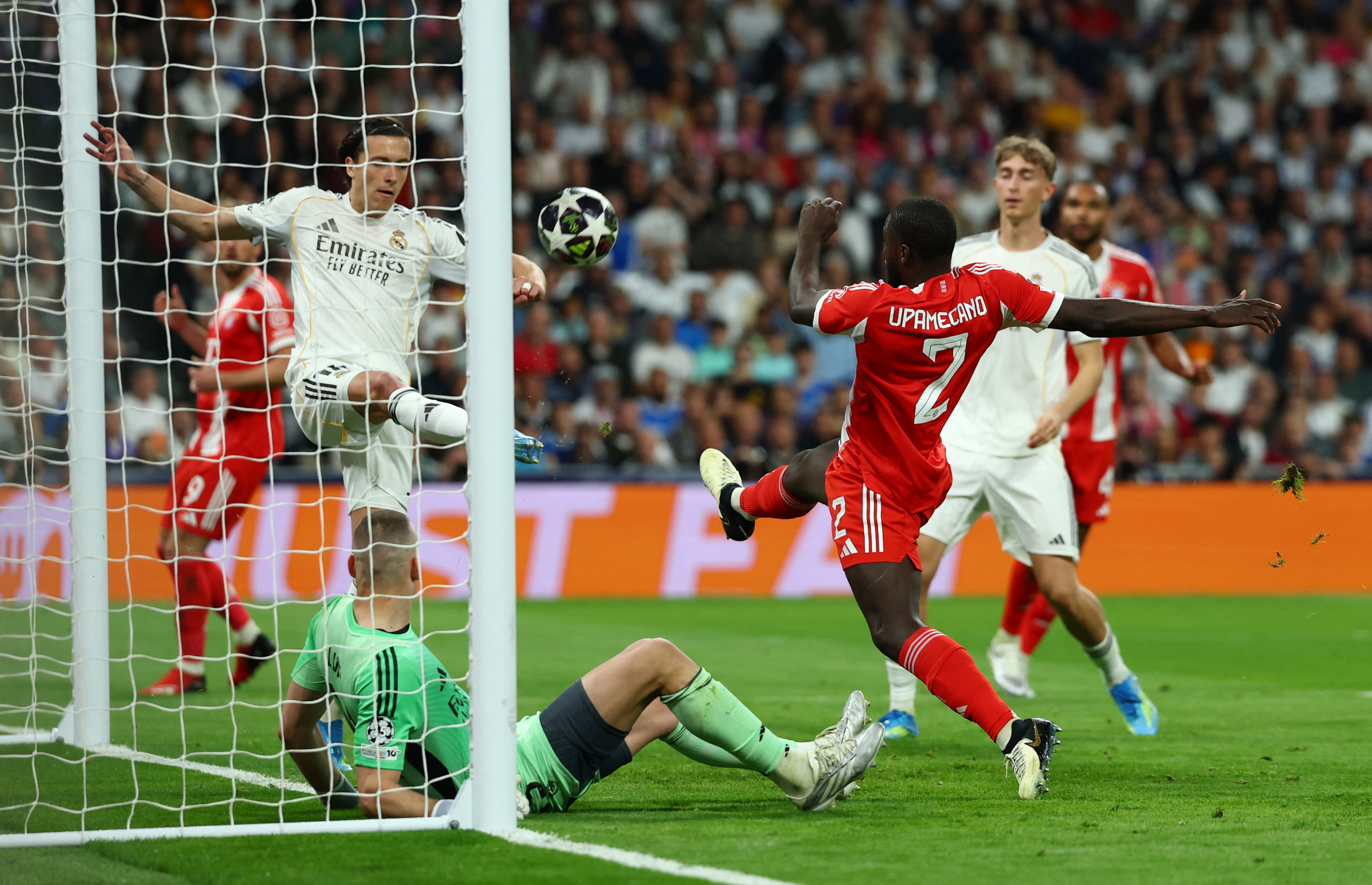 Soccer Football - UEFA Champions League - Quarter Final - First Leg - Real Madrid v Bayern Munich - Santiago Bernabeu, Madrid, Spain - April 7, 2026 Real Madrid's Alvaro Carreras in action with Bayern Munich's Dayot Upamecano REUTERS/Gonzalo Fuentes
