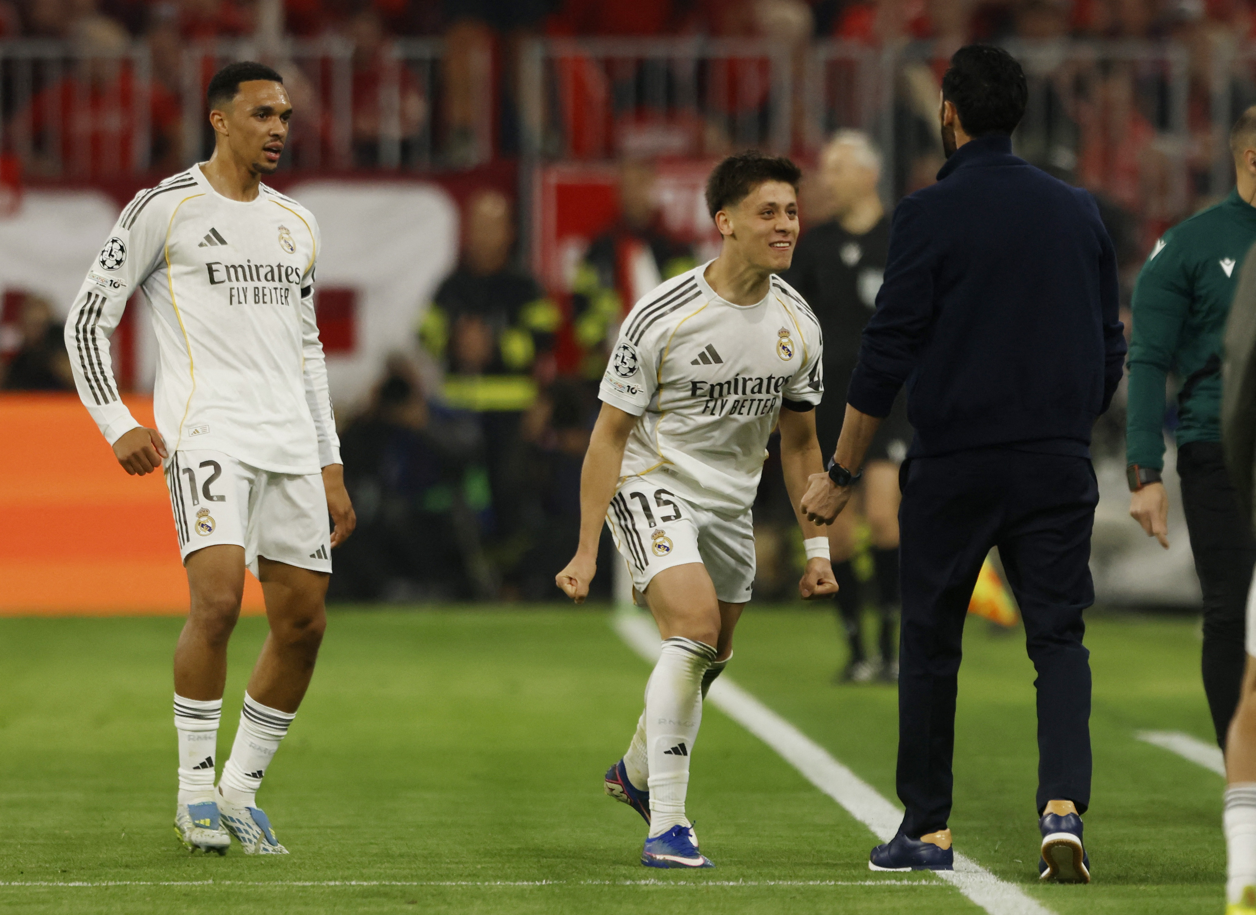 Soccer Football - UEFA Champions League - Quarter Final - Second Leg - Bayern Munich v Real Madrid - Allianz Arena, Munich, Germany - April 15, 2026 Real Madrid's Arda Guler celebrates scoring their second goal with coach Alvaro Arbeloa and Trent Alexande