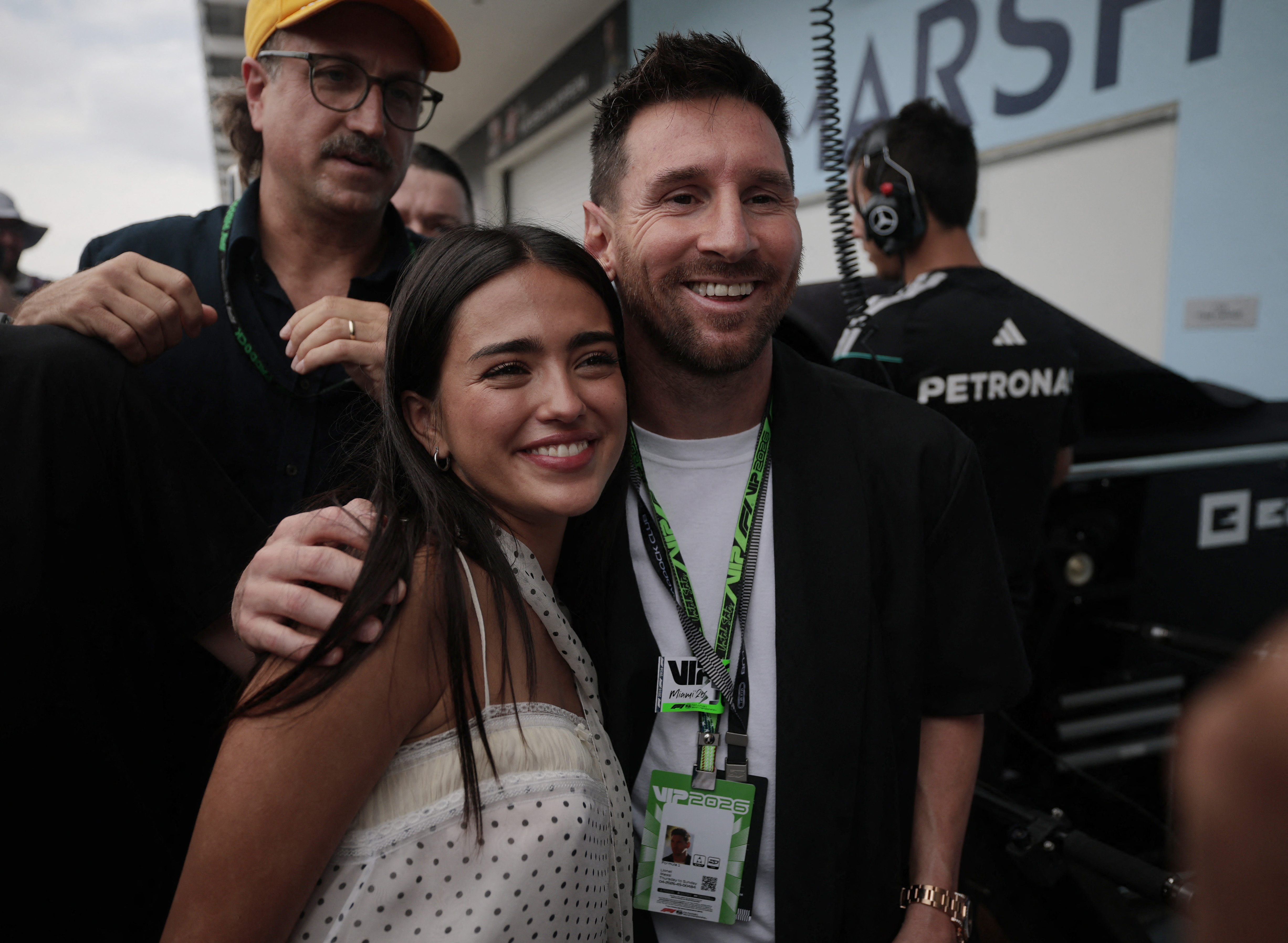 Formula One F1 - Miami Grand Prix - Miami International Autodrome, Miami, Florida, United States - May 3, 2026 Footballer Lionel Messi takes a selfie with Maia Reficco, actress and girlfriend of Alpine's Franco Colapinto in the pit lane ahead of the grand