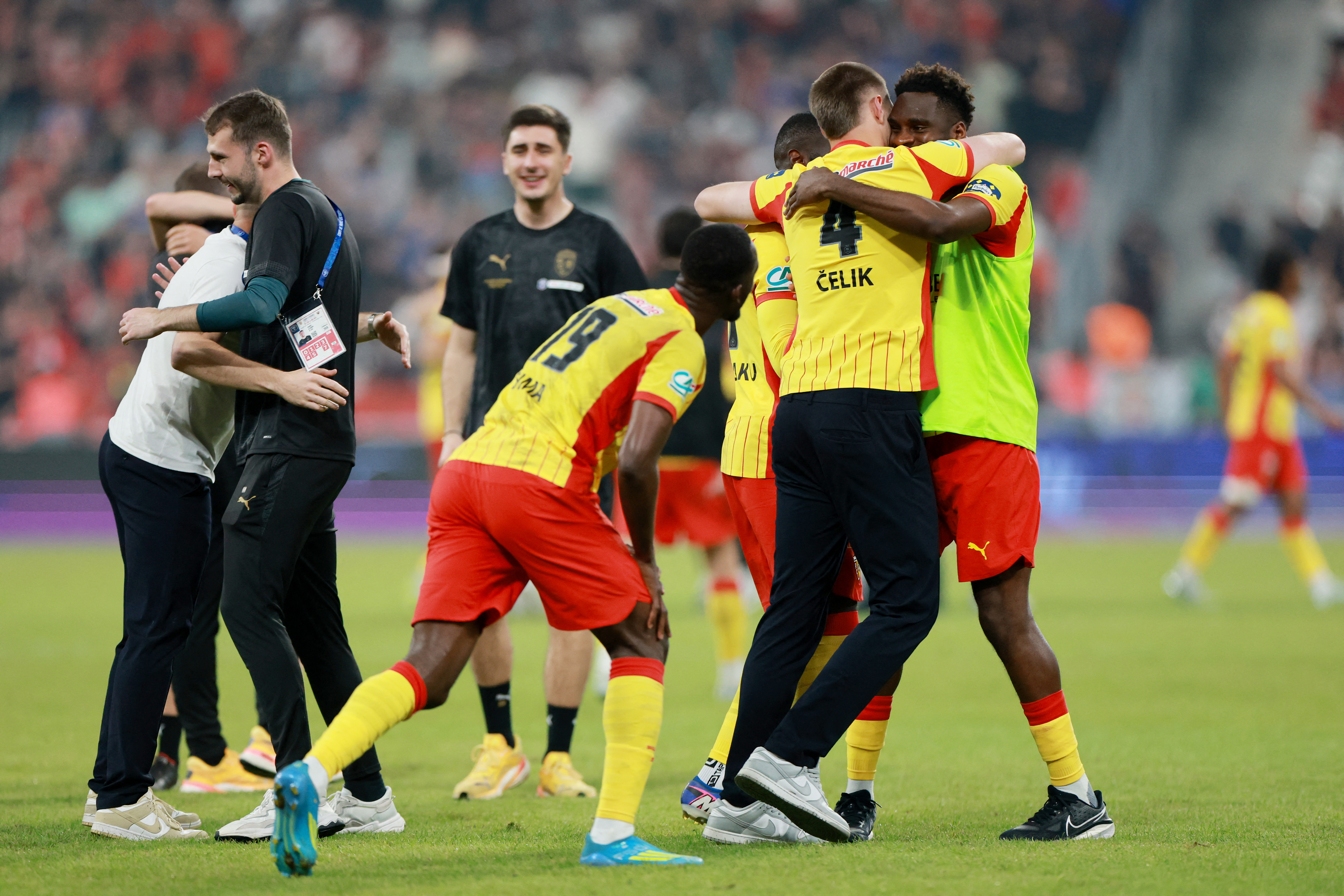Soccer Football - Coupe de France - Final - RC Lens v OGC Nice - Stade de France, Saint Denis, France - May 22, 2026 RC Lens' Odsonne Edouard celebrates with teammates after winning the Coupe de France REUTERS/Stephanie Lecocq