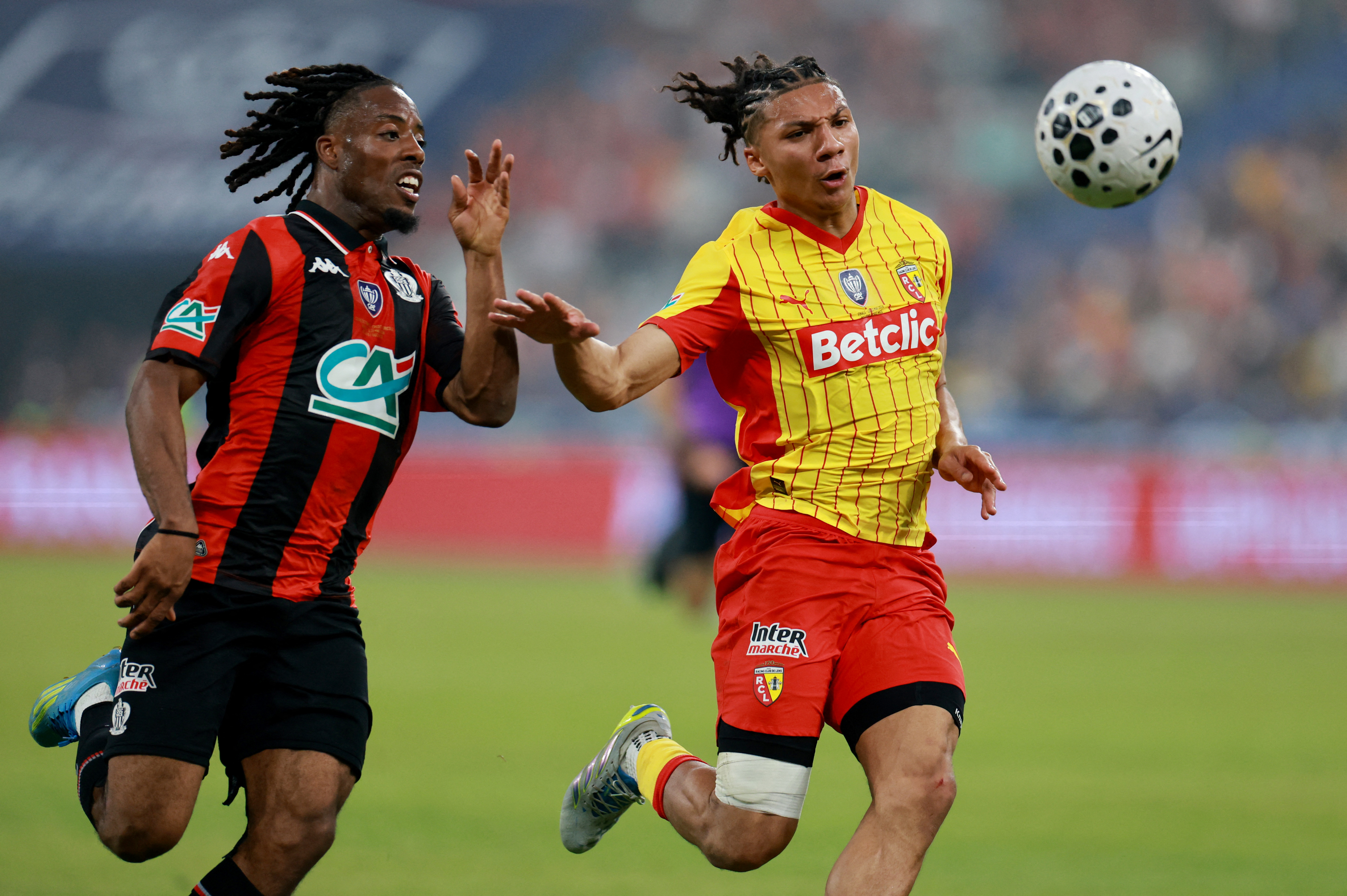 Soccer Football - Coupe de France - Final - RC Lens v OGC Nice - Stade de France, Saint Denis, France - May 22, 2026 OGC Nice's Elye Wahi in action with RC Lens' Ismaelo Ganiou REUTERS/Stephanie Lecocq