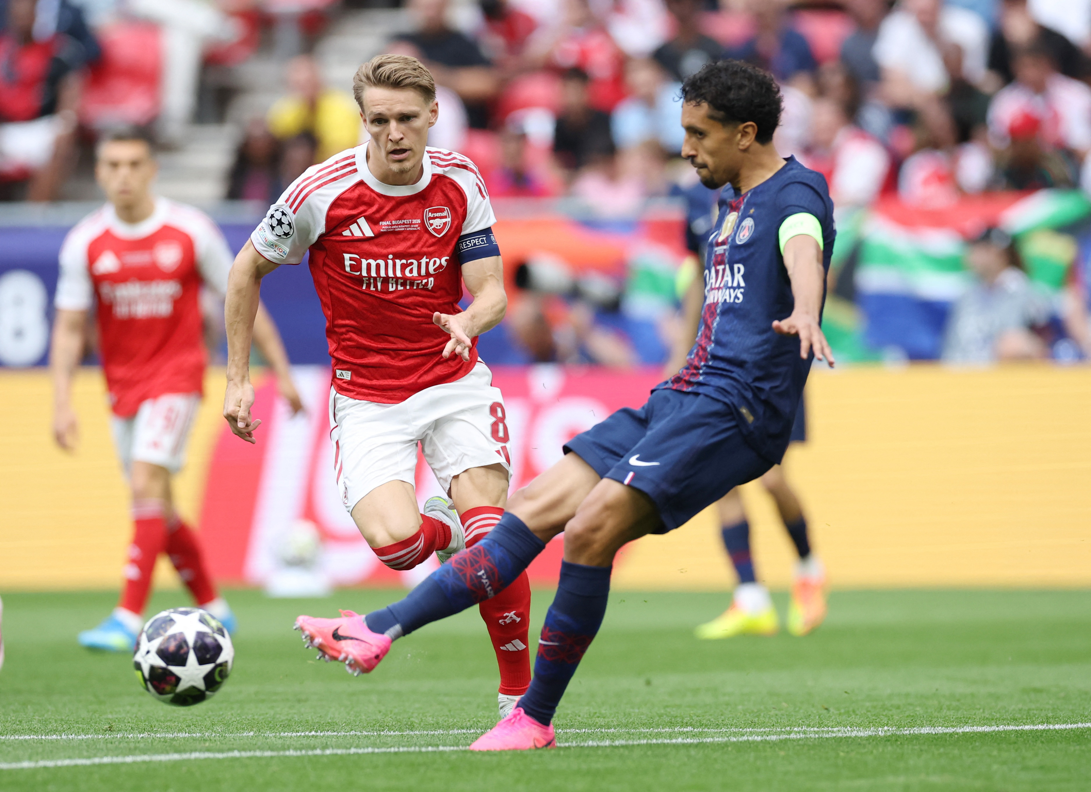 Soccer Football - UEFA Champions League - Final - Paris St Germain v Arsenal - Puskas Arena, Budapest, Hungary - May 30, 2026 Arsenal's Martin Odegaard in action with Paris St Germain's Marquinhos REUTERS/Phil Noble