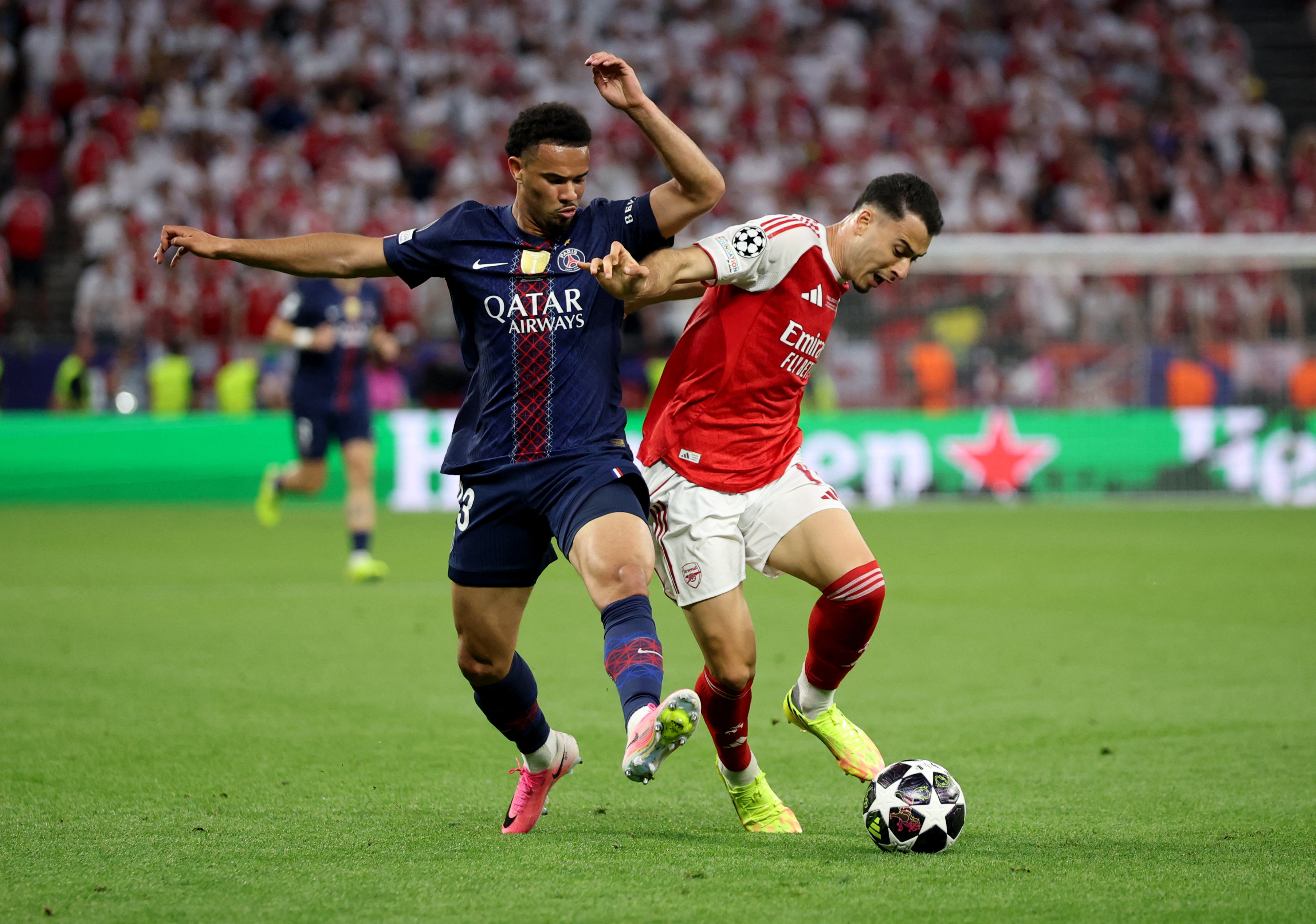 Soccer Football - UEFA Champions League - Final - Paris St Germain v Arsenal - Puskas Arena, Budapest, Hungary - May 30, 2026 Paris St Germain's Warren Zaire-Emery in action with Arsenal's Gabriel Martinelli REUTERS/Phil Noble