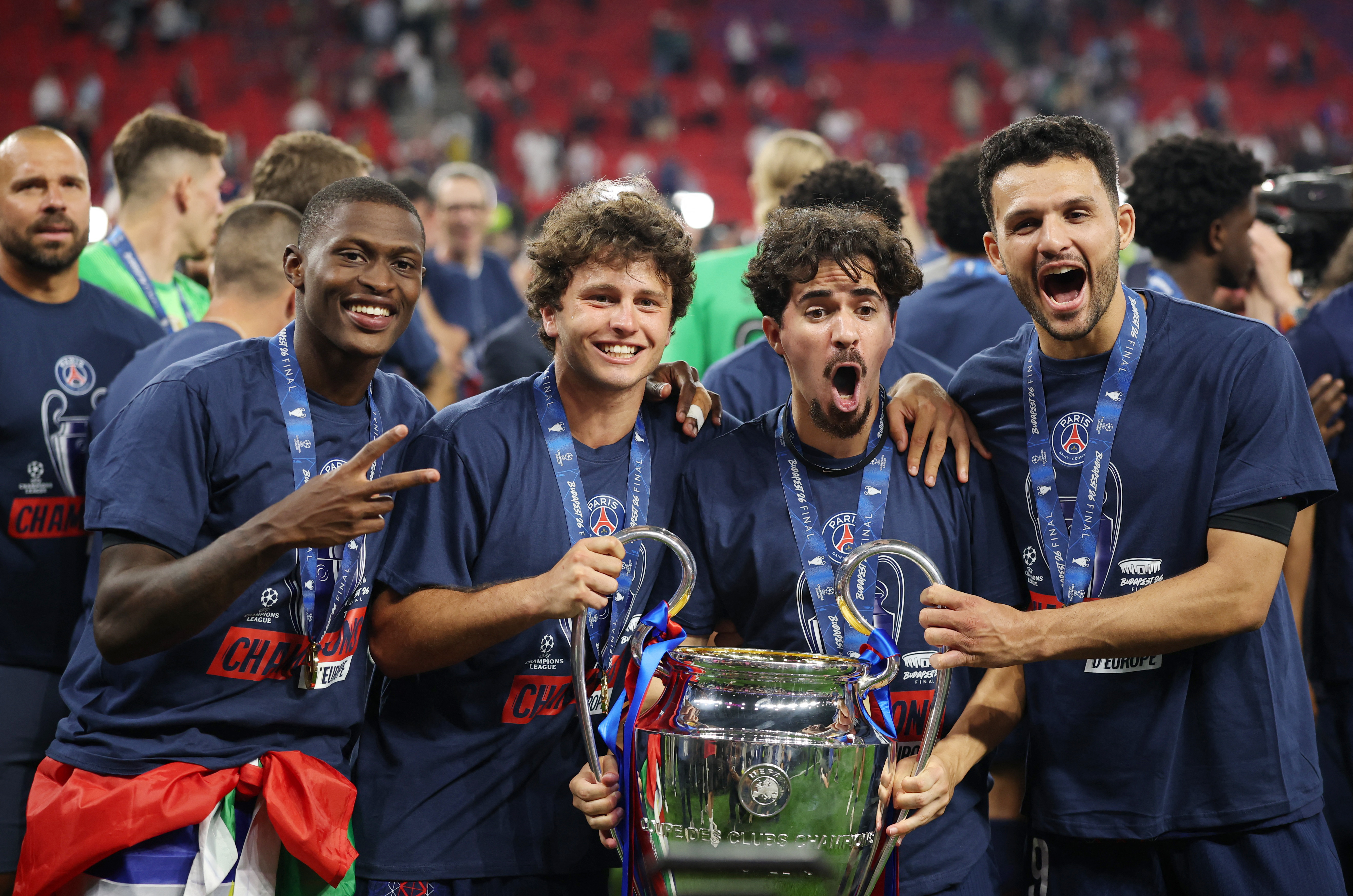 Soccer Football - UEFA Champions League - Final - Paris St Germain v Arsenal - Puskas Arena, Budapest, Hungary - May 30, 2026 Paris St Germain's Nuno Mendes, Joao Neves, Vitinha and Goncalo Ramos celebrate with the trophy after winning the UEFA Champions