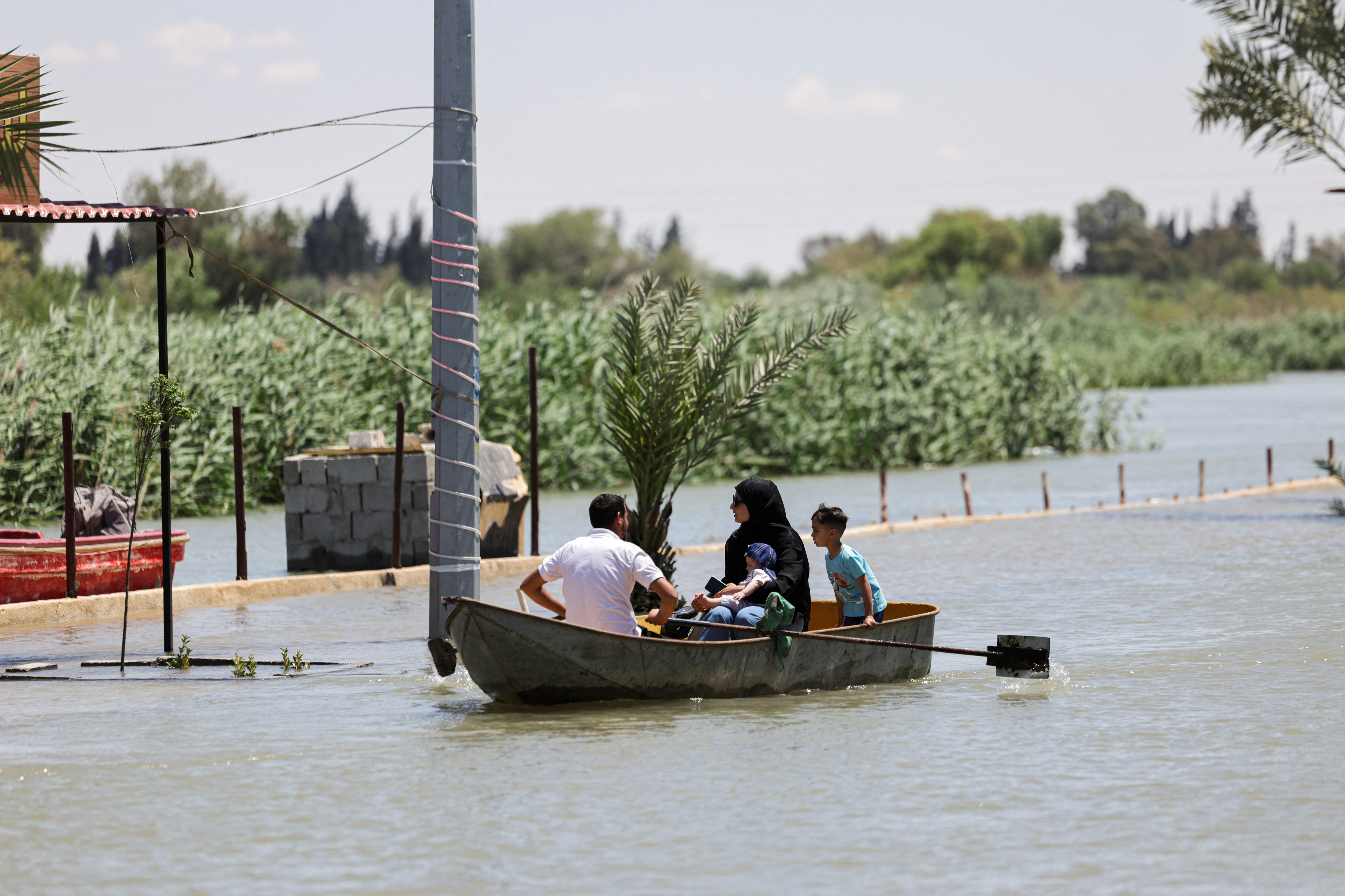2026-05-30T115259Z_1658629319_RC2KJLASR4MV_RTRMADP_3_SYRIA-DEIR-AL-ZOR-EUPHRATES-FLOOD.JPG