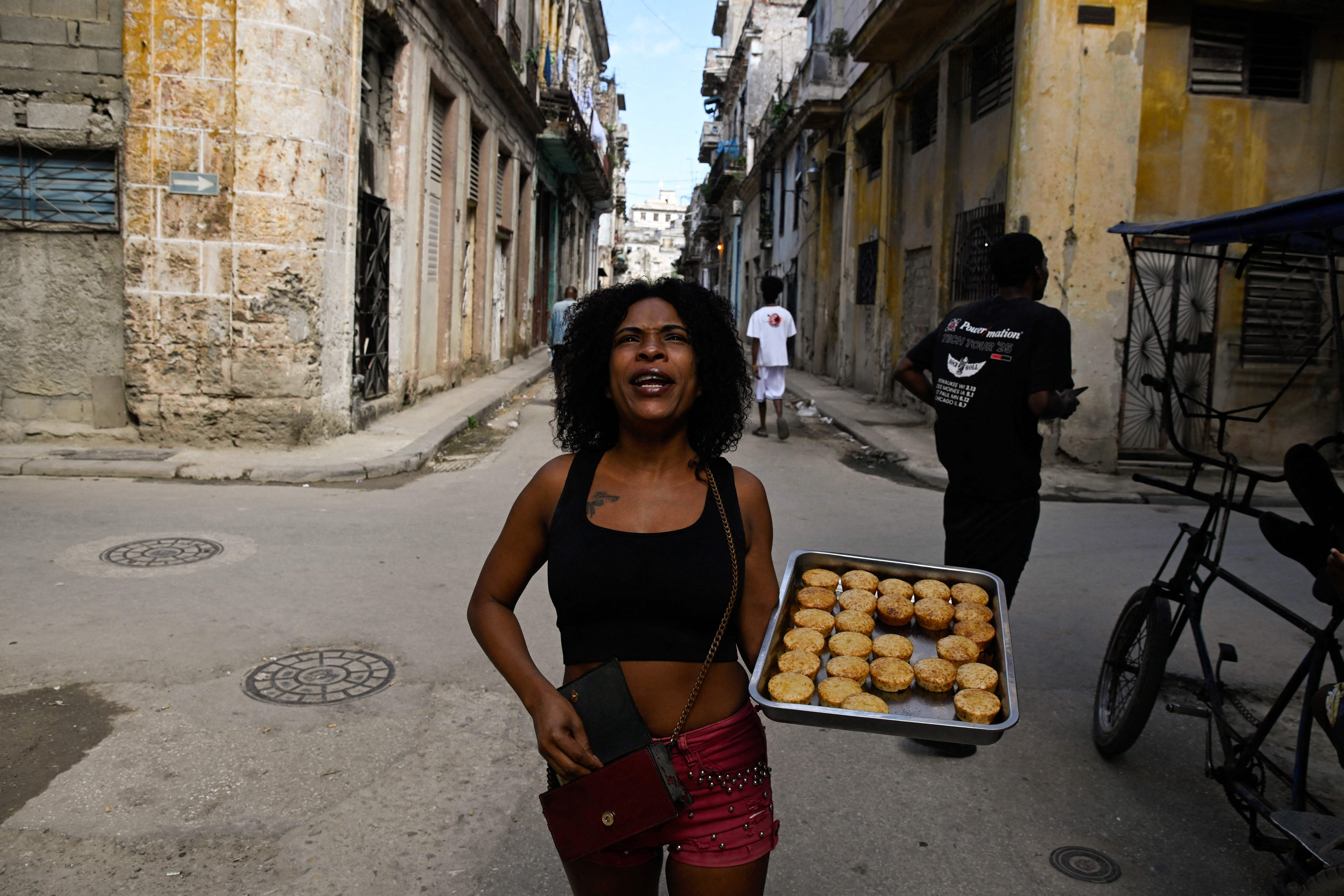 Yamile Leiva sells homemade pound cakes on a street