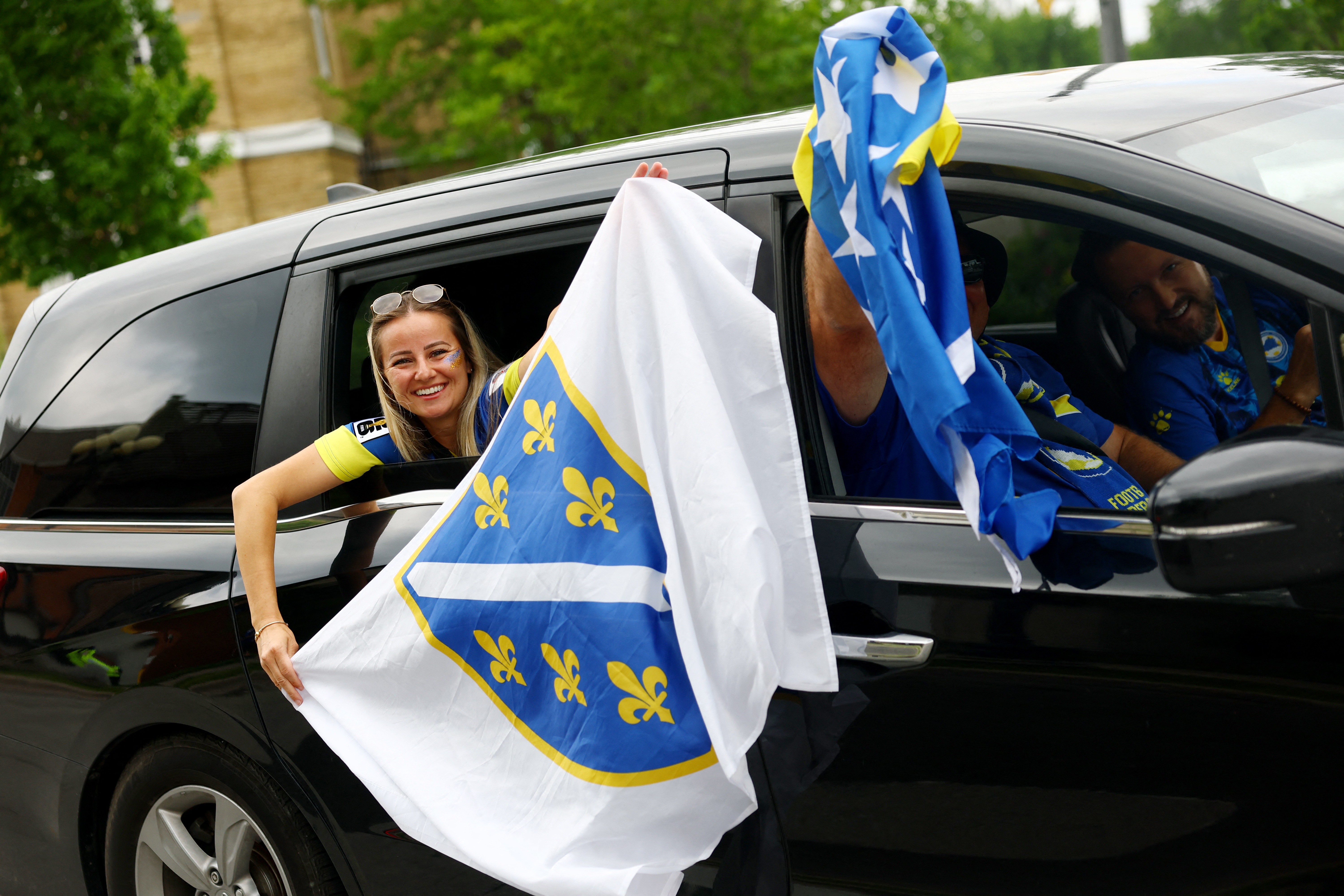 Soccer Football - FIFA World Cup 2026 - Group B - Canada v Bosnia and Herzegovina - Toronto Stadium, Toronto, Canada - June 12, 2026 Bosnia and Herzegovina fans with flags outside the stadium before the match IMAGN IMAGES via Reuters/Claudia Greco