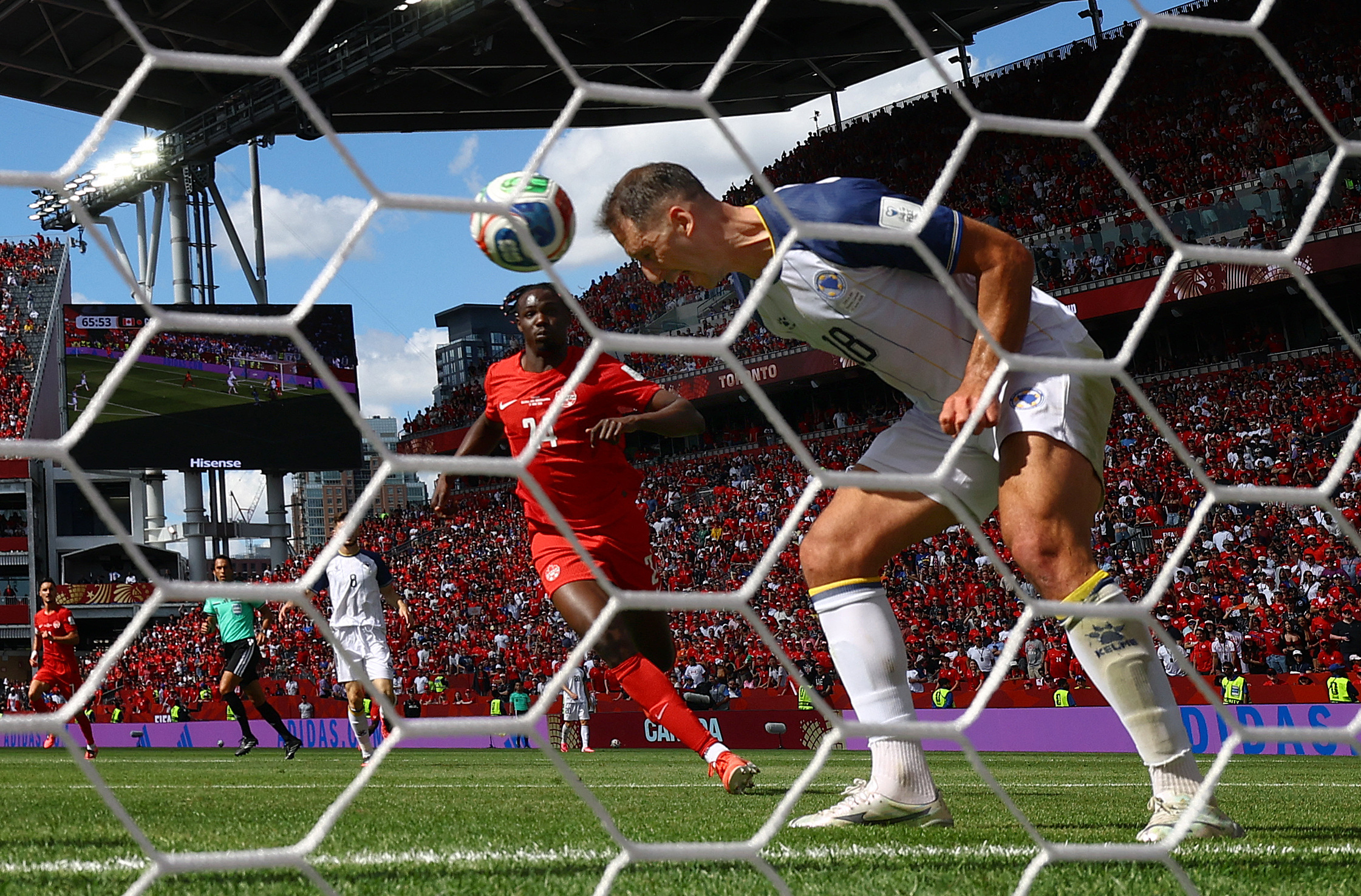 Soccer Football - FIFA World Cup 2026 - Group B - Canada v Bosnia and Herzegovina - Toronto Stadium, Toronto, Canada - June 12, 2026 Bosnia and Herzegovina's Nikola Katic heads the ball clear from the goal line REUTERS/Claudia Greco
