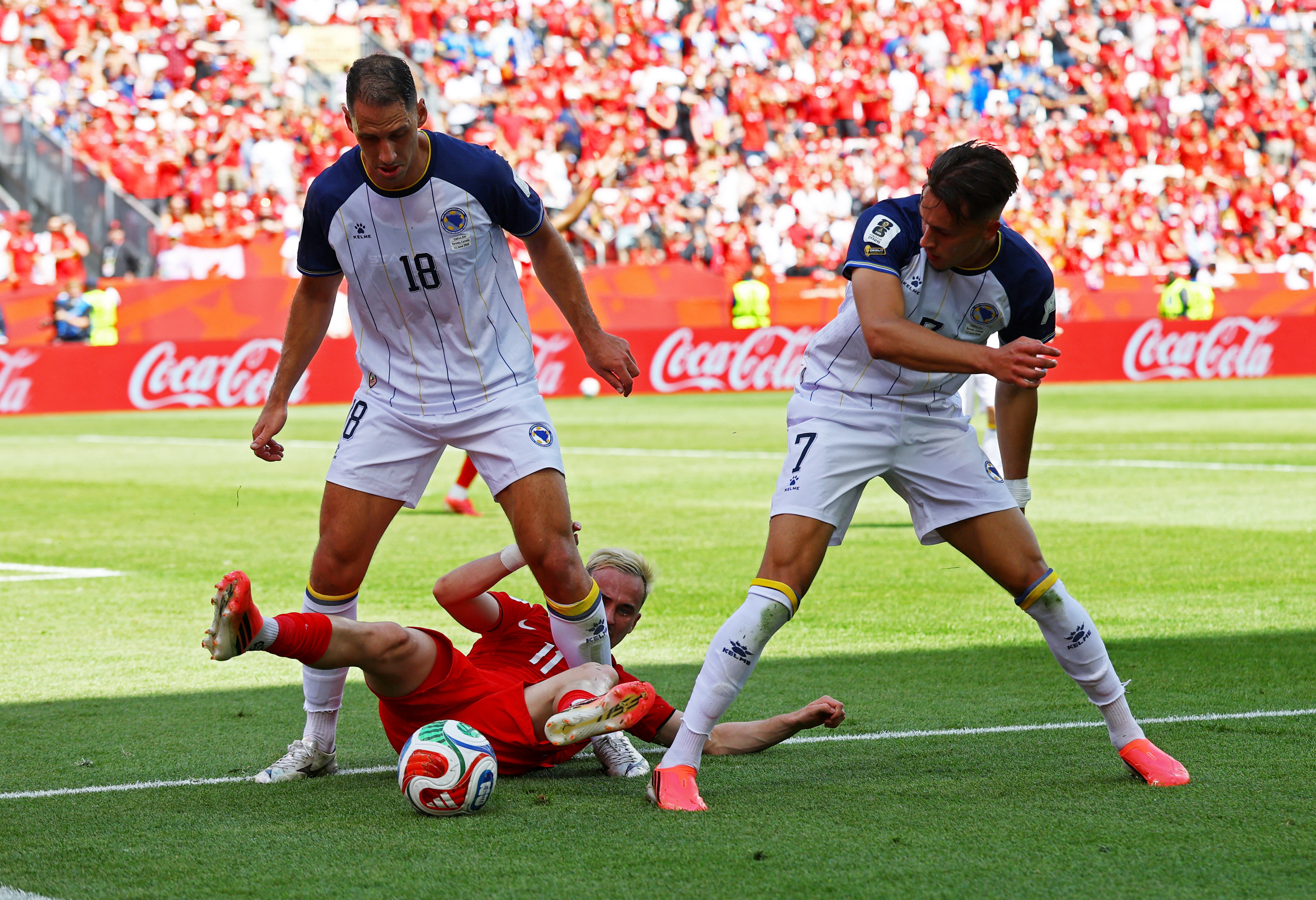 Soccer Football - FIFA World Cup 2026 - Group B - Canada v Bosnia and Herzegovina - Toronto Stadium, Toronto, Canada - June 12, 2026 Bosnia and Herzegovina's Nikola Katic and Amar Dedic in action with Canada's Liam Millar REUTERS/Bernadett Szabo