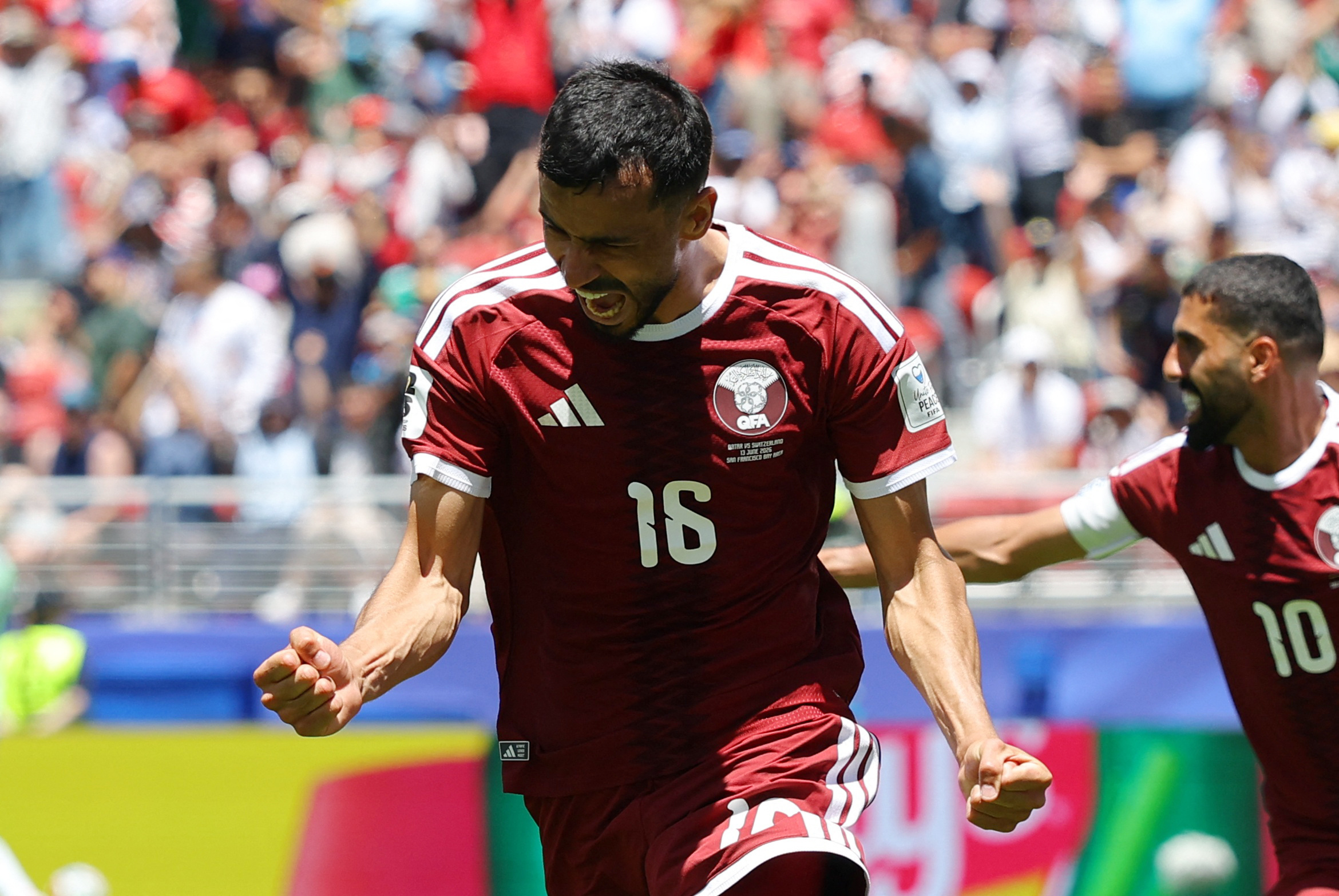 Soccer Football - FIFA World Cup 2026 - Group B - Qatar v Switzerland - San Francisco Bay Area Stadium, Santa Clara, California, U.S. - June 13, 2026 Qatar's Boualem Khoukhi celebrates scoring their first goal REUTERS/Carlos Barria
