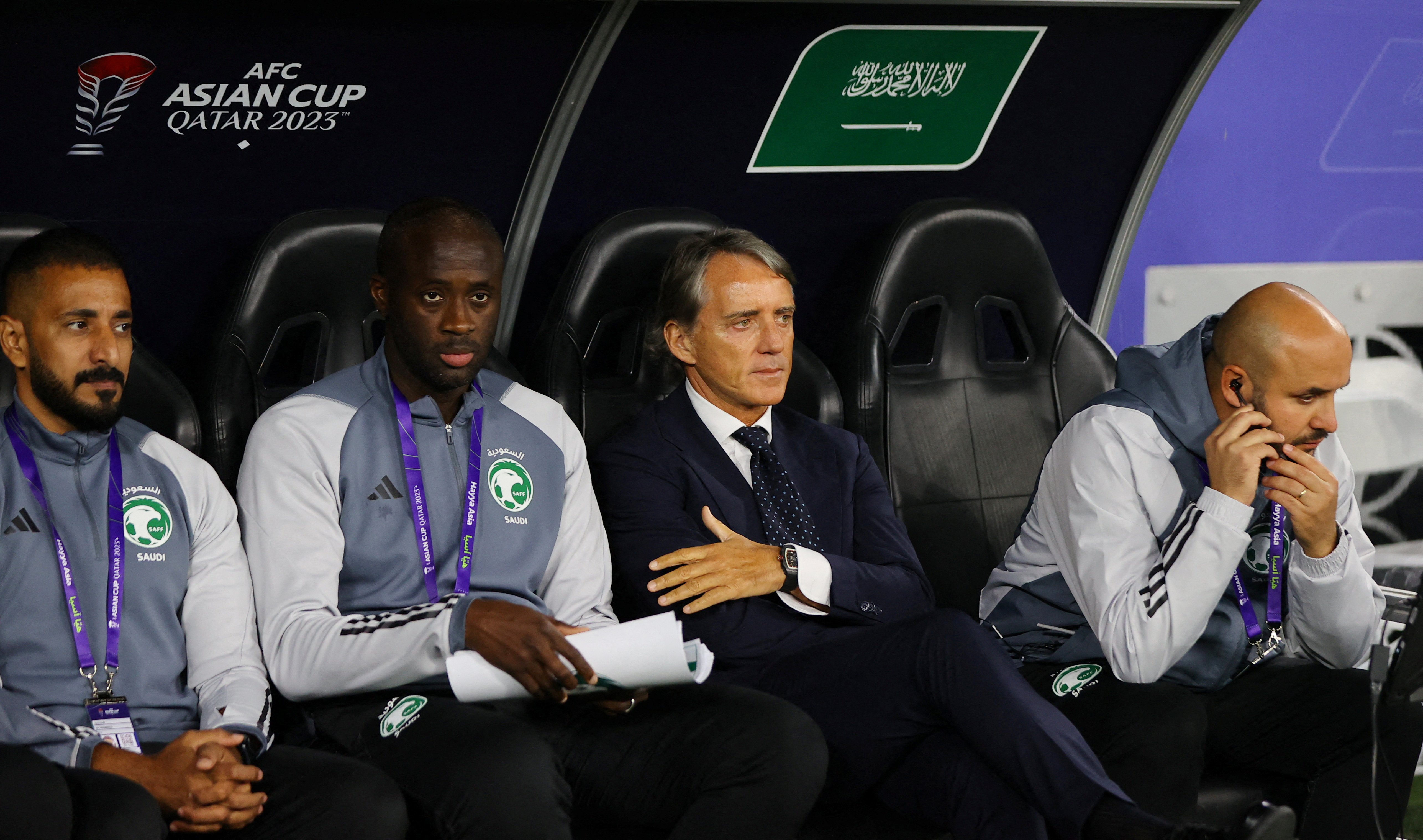 FILE PHOTO: Soccer Football - AFC Asian Cup - Group F - Kyrgyzstan v Saudi Arabia - Ahmad bin Ali Stadium, Al Rayyan, Qatar - January 21, 2024 Saudi Arabia coach Roberto Mancini and assistant coach Yaya Toure before the match REUTERS/Ibraheem Al Omari/Fil