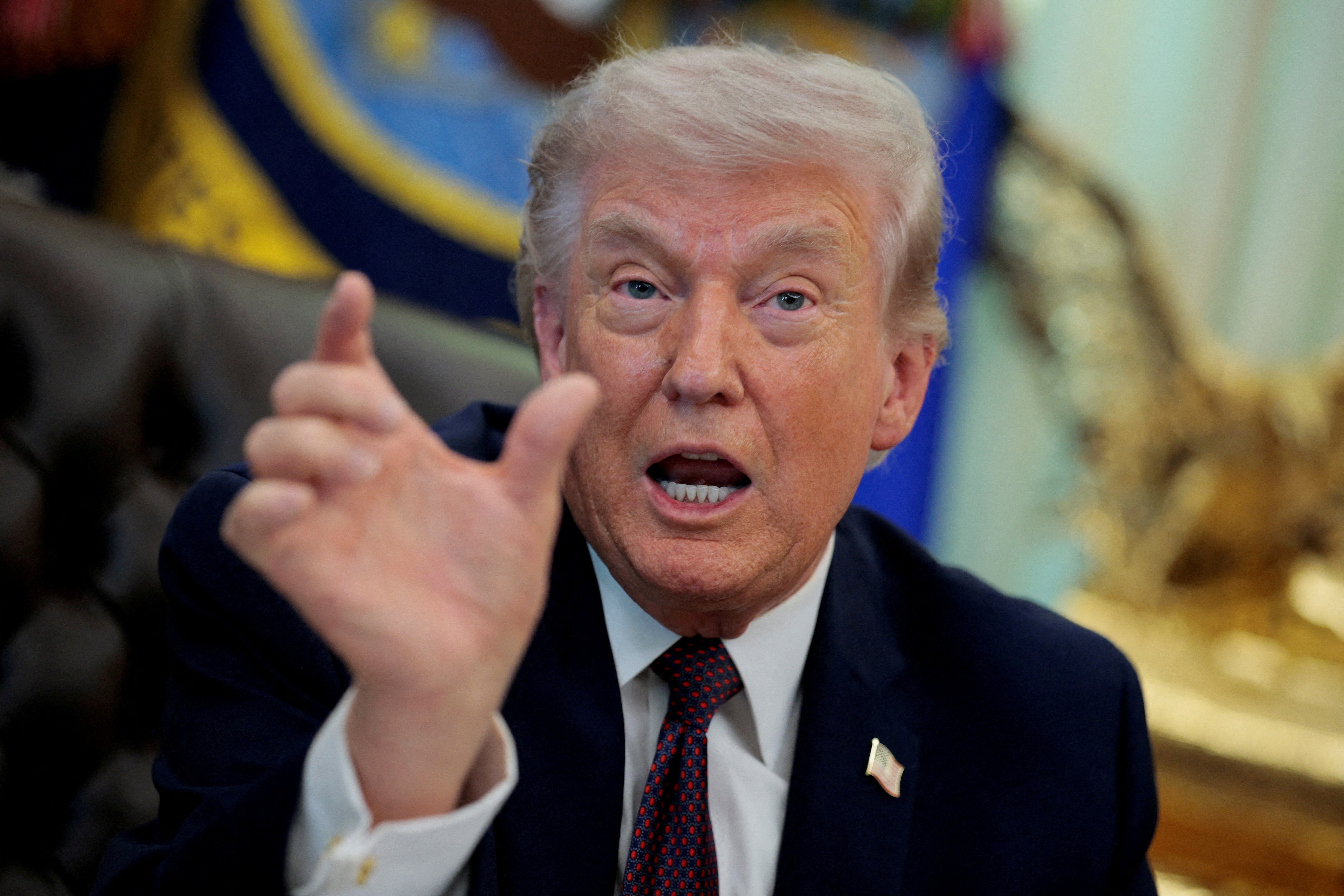 FILE PHOTO: U.S. President Donald Trump speaks during the signing ceremony for an executive order on mail ballots, in the Oval Office of the White House in Washington, D.C., March 31, 2026.  REUTERS/Evan Vucci/File Photo