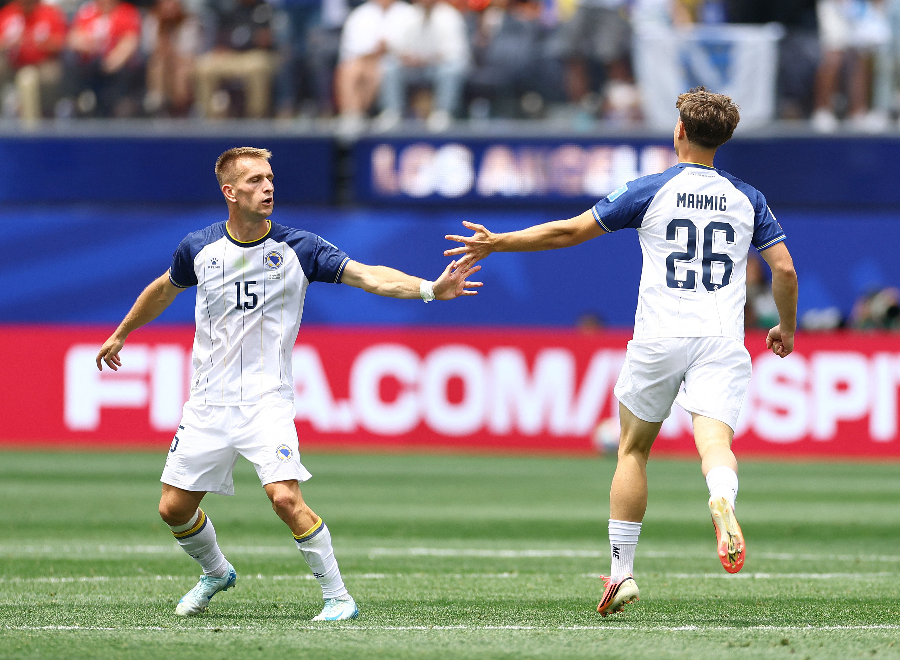 Soccer Football - FIFA World Cup 2026 - Group B - Switzerland v Bosnia and Herzegovina - Los Angeles Stadium, Inglewood, California, U.S. - June 18, 2026 Bosnia and Herzegovina's Ermin Mahmic celebrates scoring their first goal with Amar Memic REUTERS/Lis