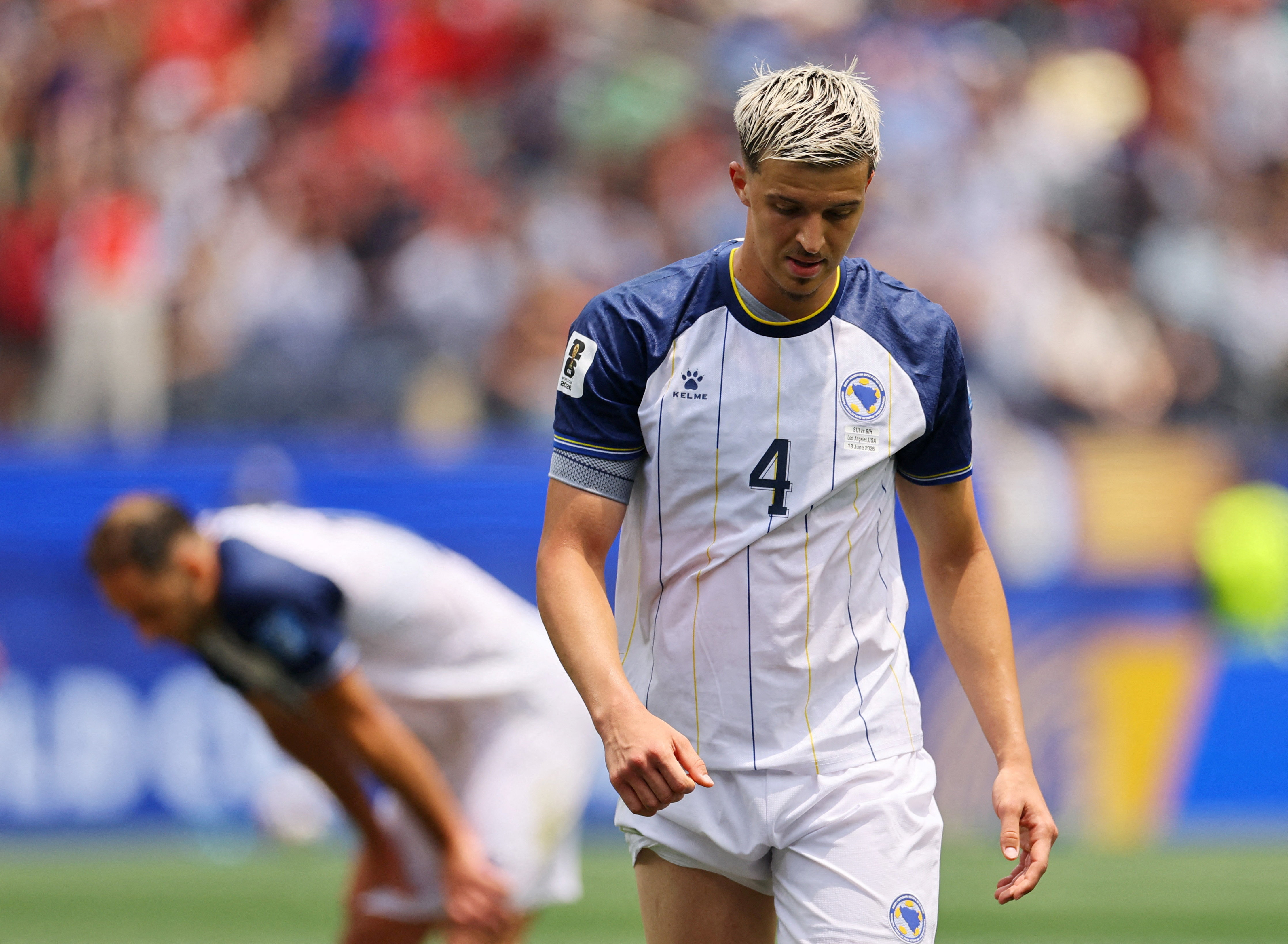 Soccer Football - FIFA World Cup 2026 - Group B - Switzerland v Bosnia and Herzegovina - Los Angeles Stadium, Inglewood, California, U.S. - June 18, 2026 Bosnia and Herzegovina's Tarik Muharemovic walks off the pitch after he is shown a red card by refere