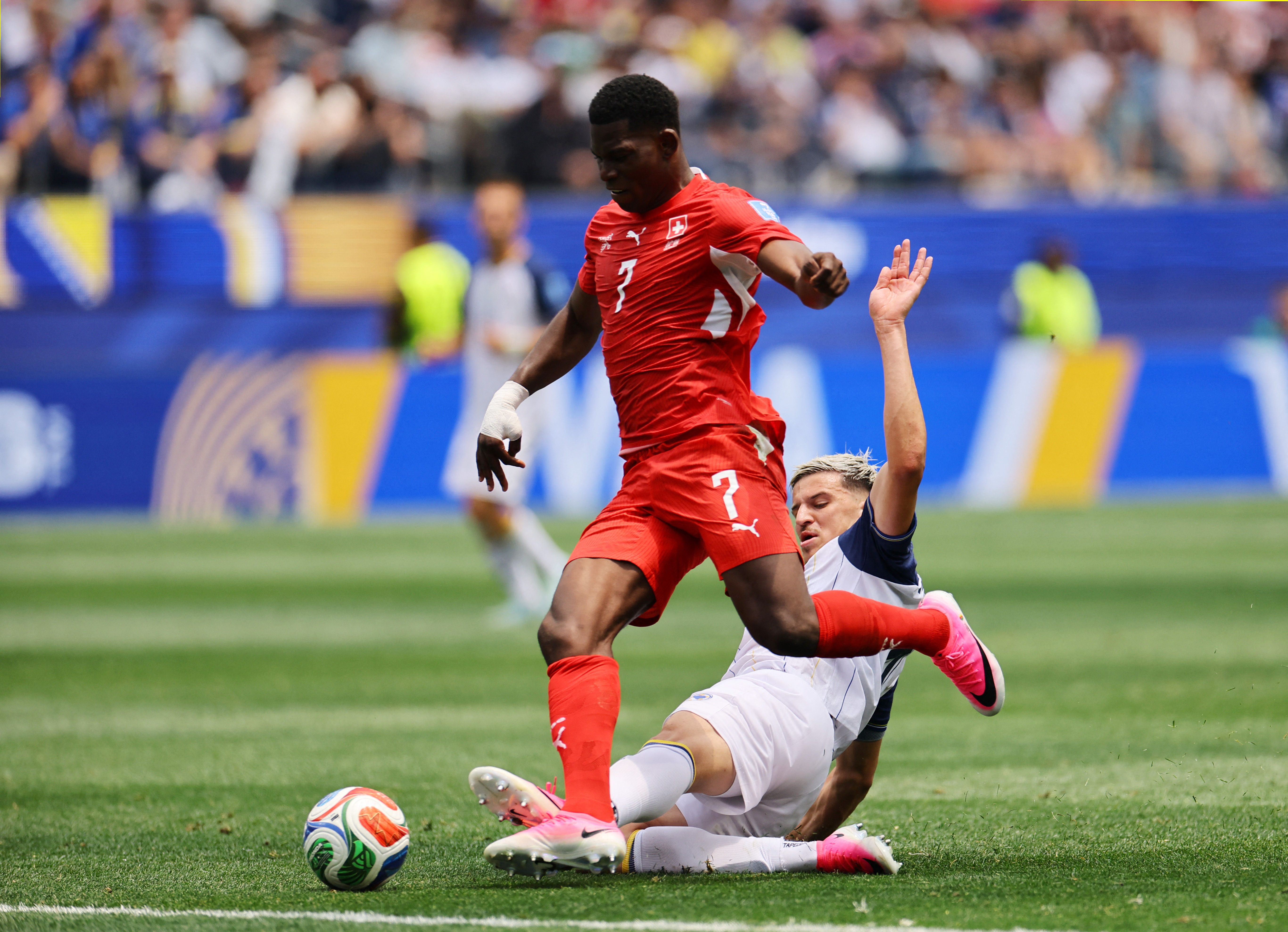 Soccer Football - FIFA World Cup 2026 - Group B - Switzerland v Bosnia and Herzegovina - Los Angeles Stadium, Inglewood, California, U.S. - June 18, 2026 Bosnia and Herzegovina's Tarik Muharemovic commits a foul on Switzerland's Breel Embolo resulting in
