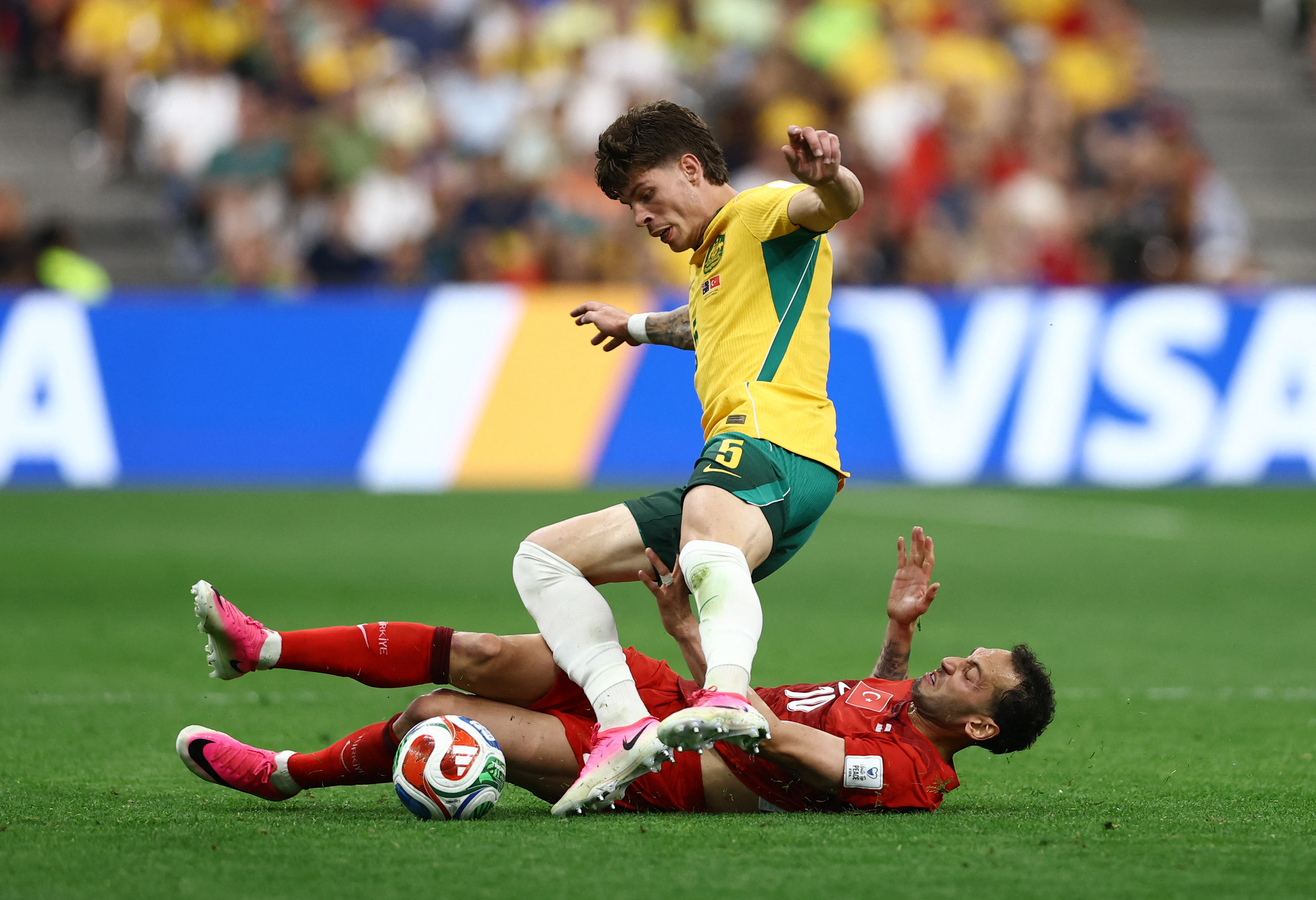 Soccer Football - FIFA World Cup 2026 - Group D - Australia v Turkey - BC Place, Vancouver, Canada - June 13, 2026 Australia's Jordan Bos in action with Turkey's Hakan Calhanoglu REUTERS/Lee Smith