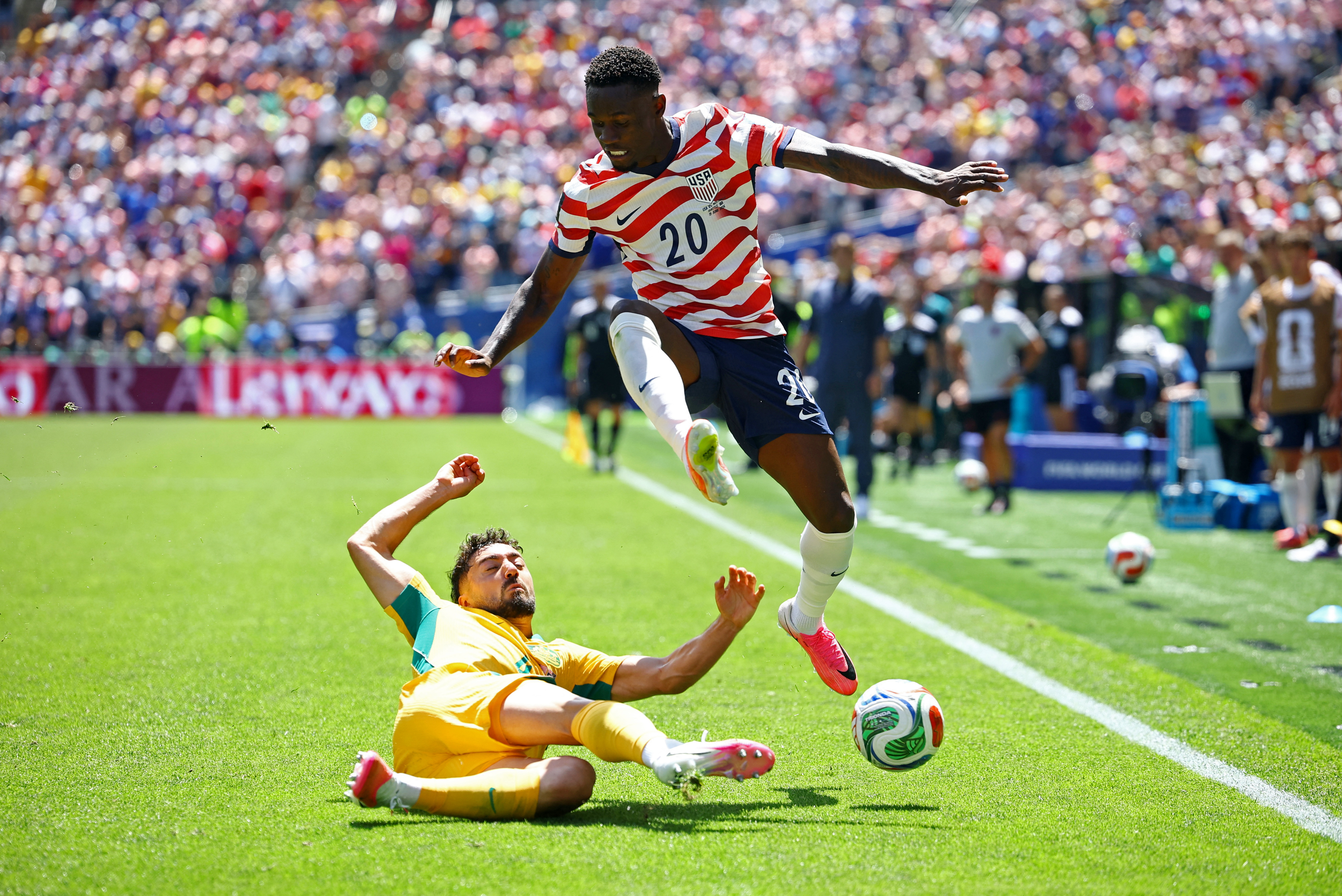Soccer Football - FIFA World Cup 2026 - Group D - United States v Australia - Seattle Stadium, Seattle, Washington, U.S. - June 19, 2026 Folarin Balogun of the U.S. in action with Australia's Jacob Italiano REUTERS/Albert Gea