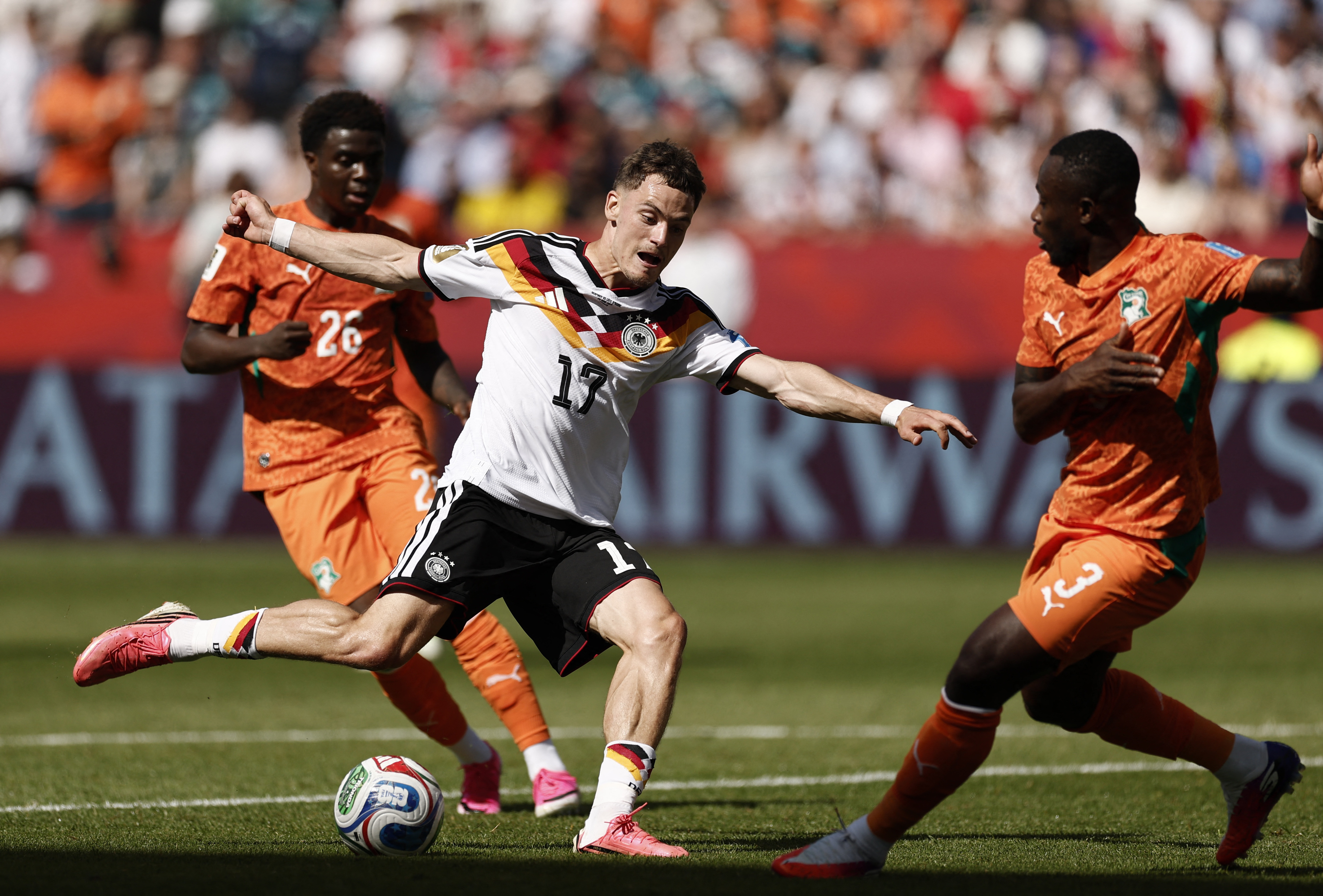 Soccer Football - FIFA World Cup 2026 - Group E - Germany v Ivory Coast - Toronto Stadium, Toronto, Canada - June 20, 2026 Germany's Florian Wirtz in action with Ivory Coast's Ghislain Konan and Christ Oulai REUTERS/Benoit Tessier