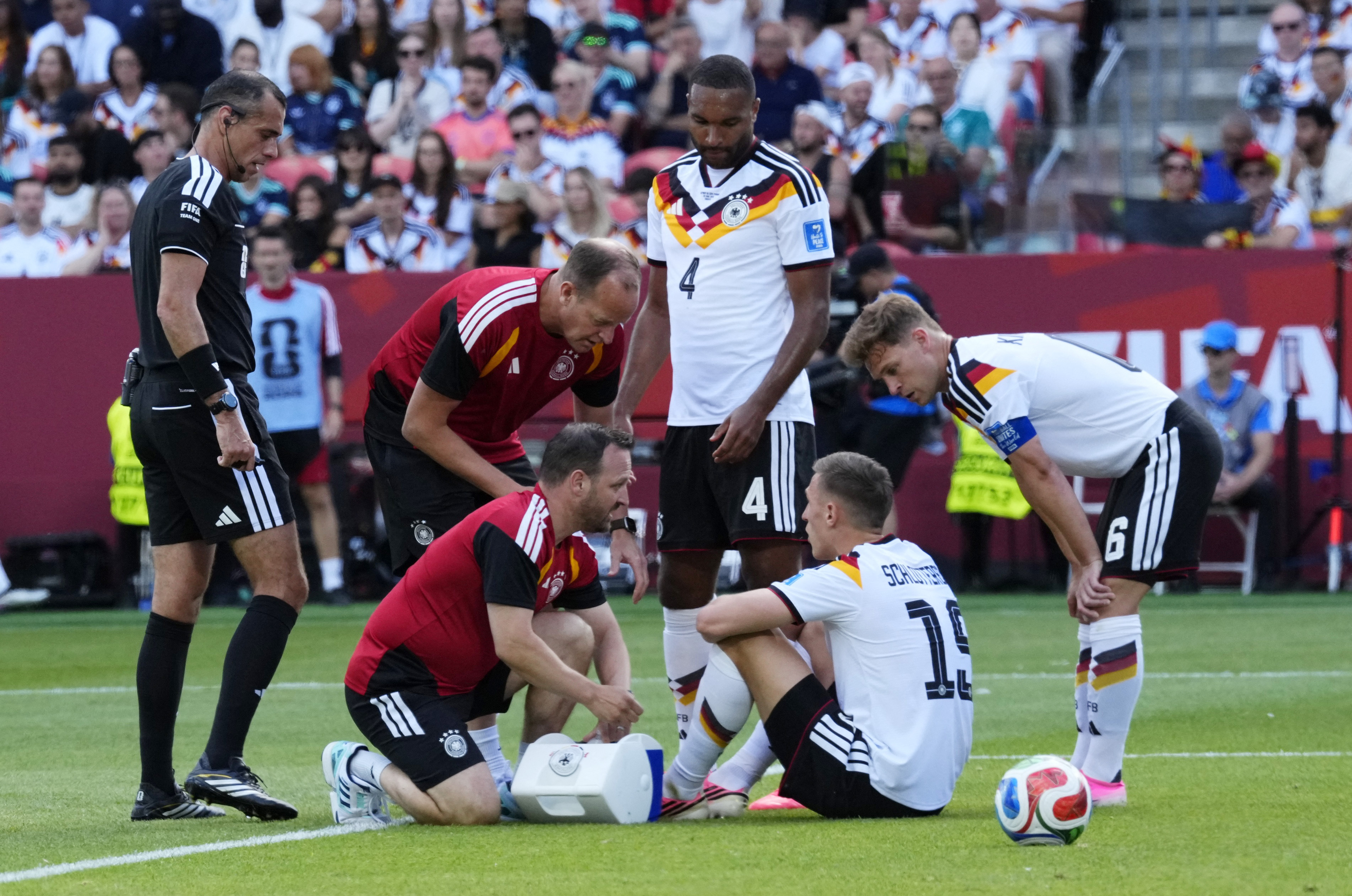 Soccer Football - FIFA World Cup 2026 - Group E - Germany v Ivory Coast - Toronto Stadium, Toronto, Canada - June 20, 2026 Germany's Nico Schlotterbeck receives medical attention after sustaining an injury IMAGN IMAGES via Reuters/Kevin Sousa