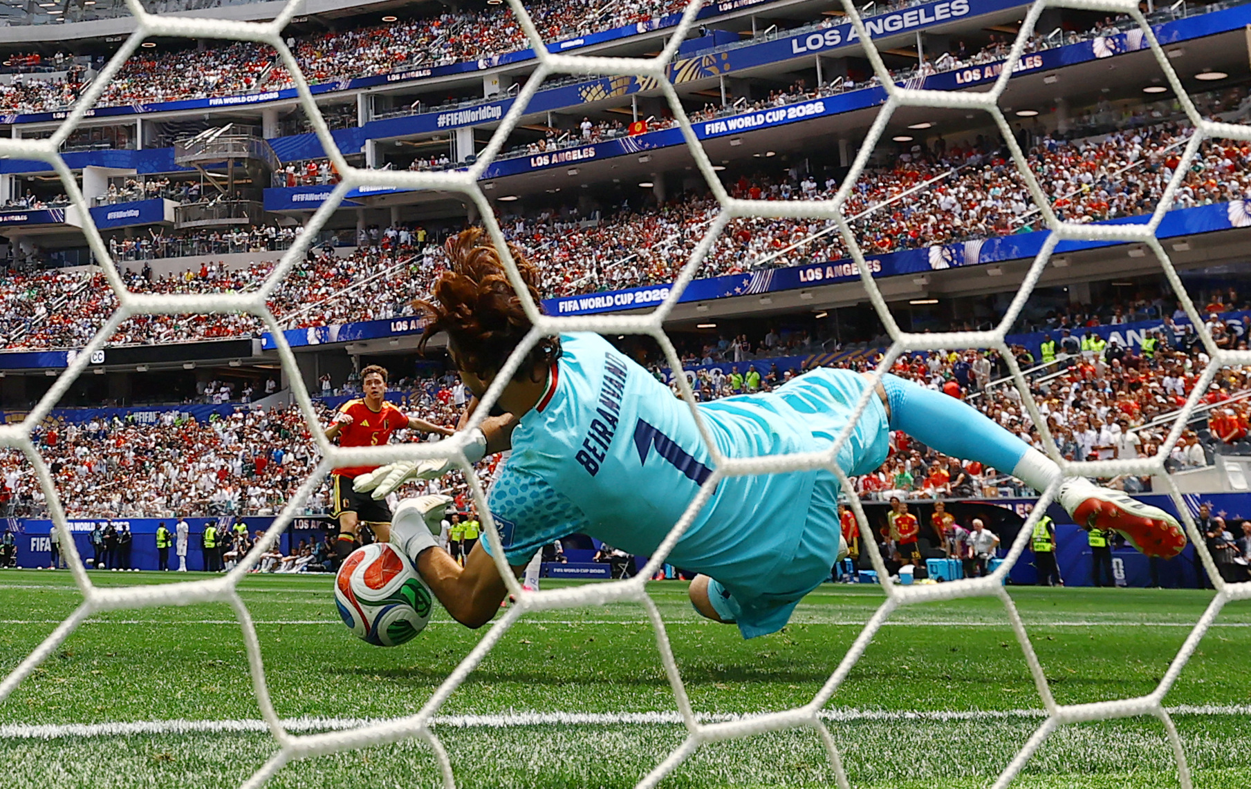 Soccer Football - FIFA World Cup 2026 - Group G - Belgium v Iran - Los Angeles Stadium, Inglewood, California, U.S. - June 21, 2026 Iran's Alireza Beiranvand makes a save from Belgium's Maxim De Cuyper REUTERS/Daniel Cole