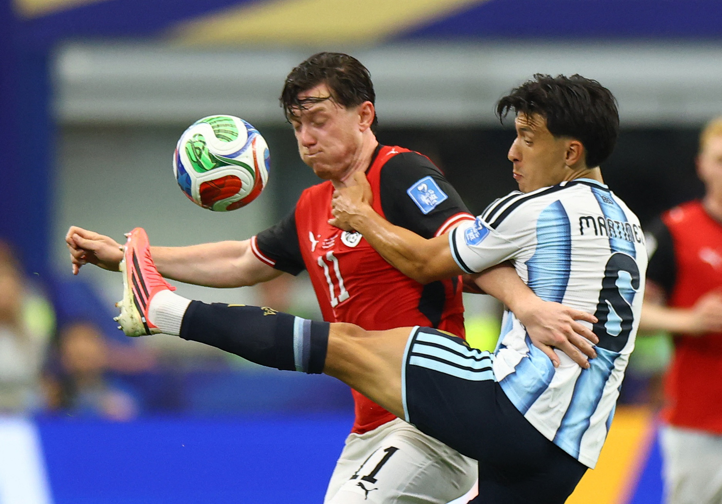 Soccer Football - FIFA World Cup 2026 - Group J - Argentina v Austria - Dallas Stadium, Arlington, Texas, U.S. - June 22, 2026 Austria's Michael Gregoritsch in action with Argentina's Lisandro Martinez REUTERS/Hannah Mckay